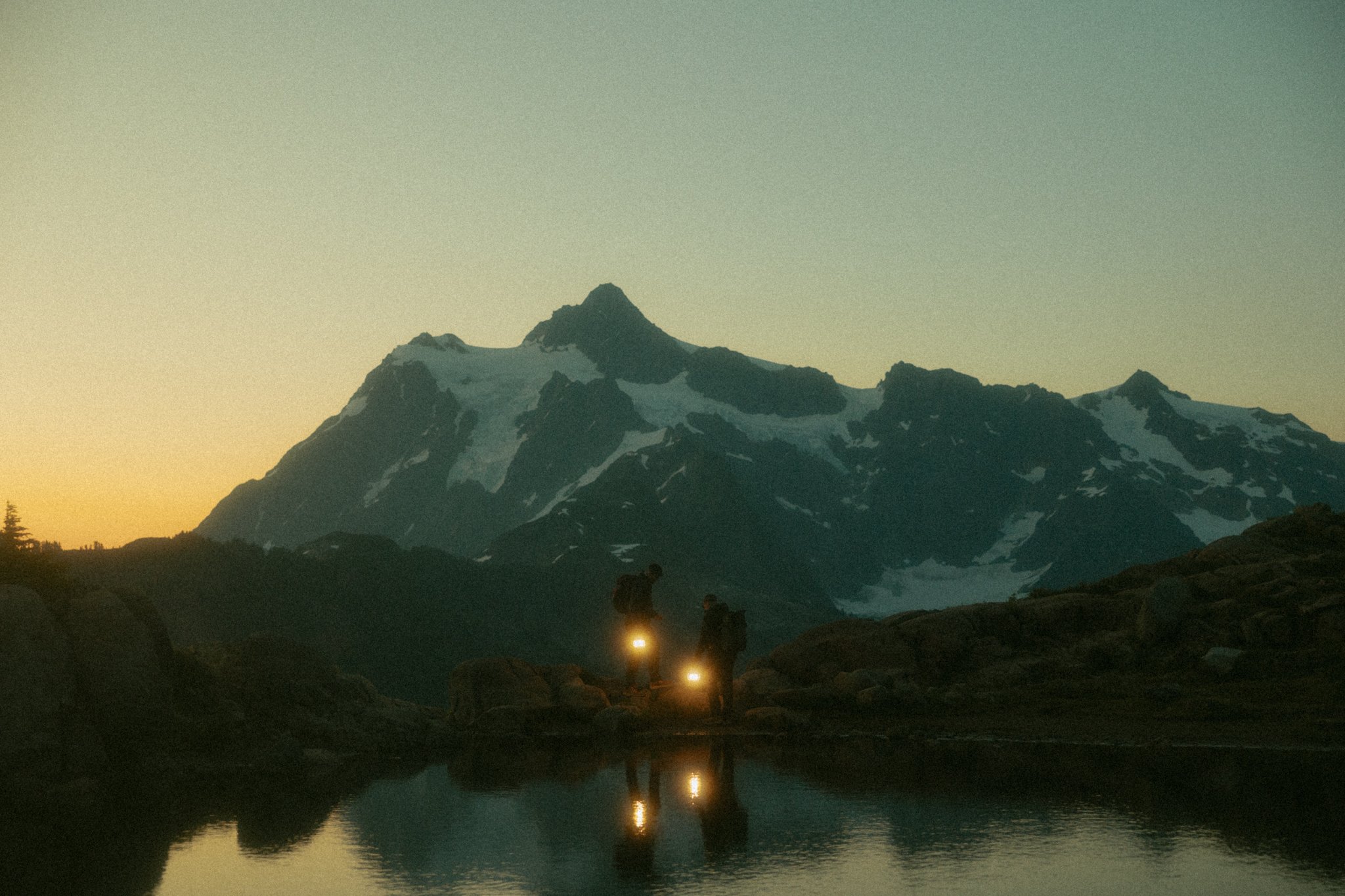 couple hiking to their elopement spot in Washington's North Cascades
