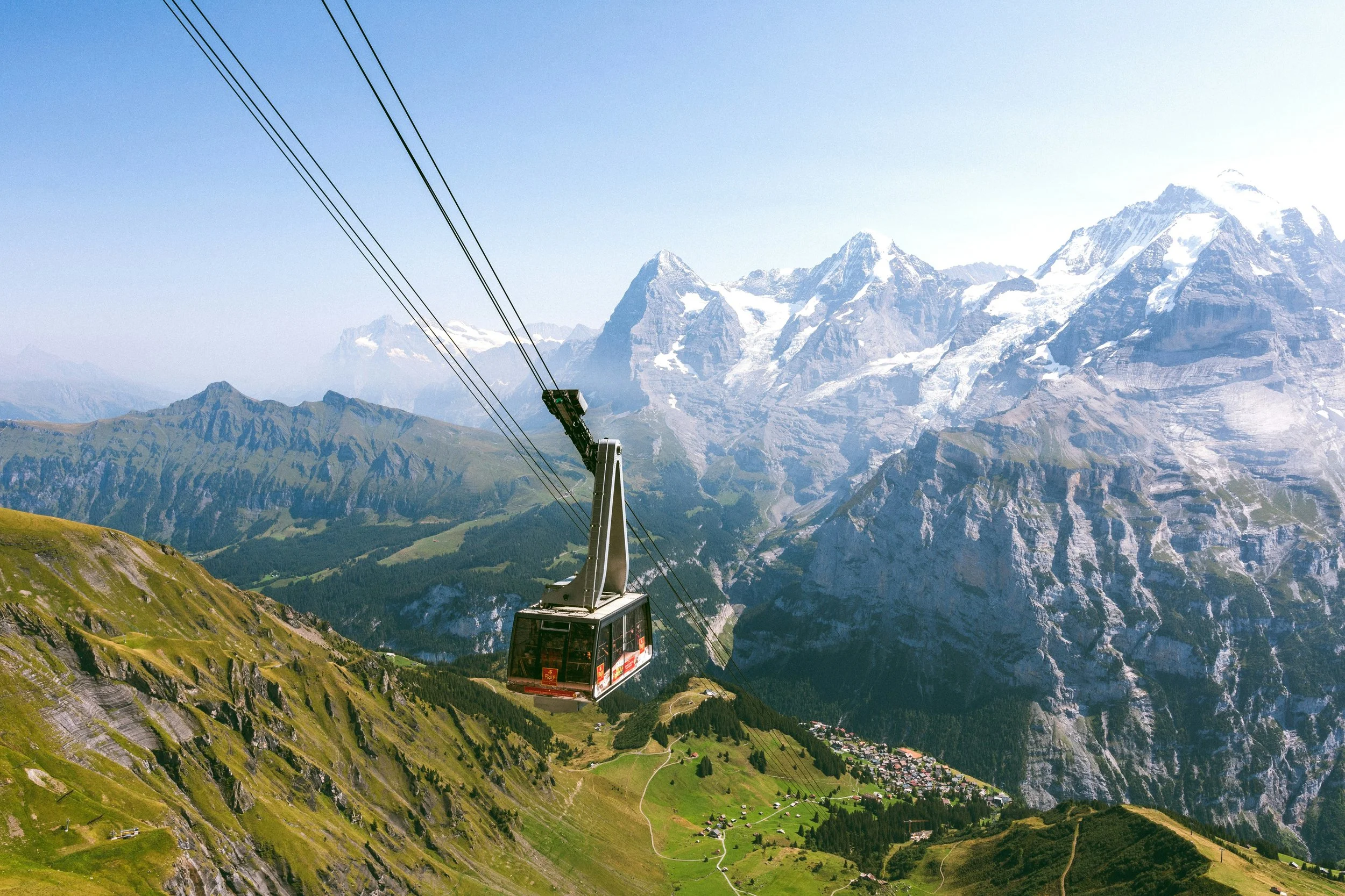 gondola going up mountain in the Switzerland alps