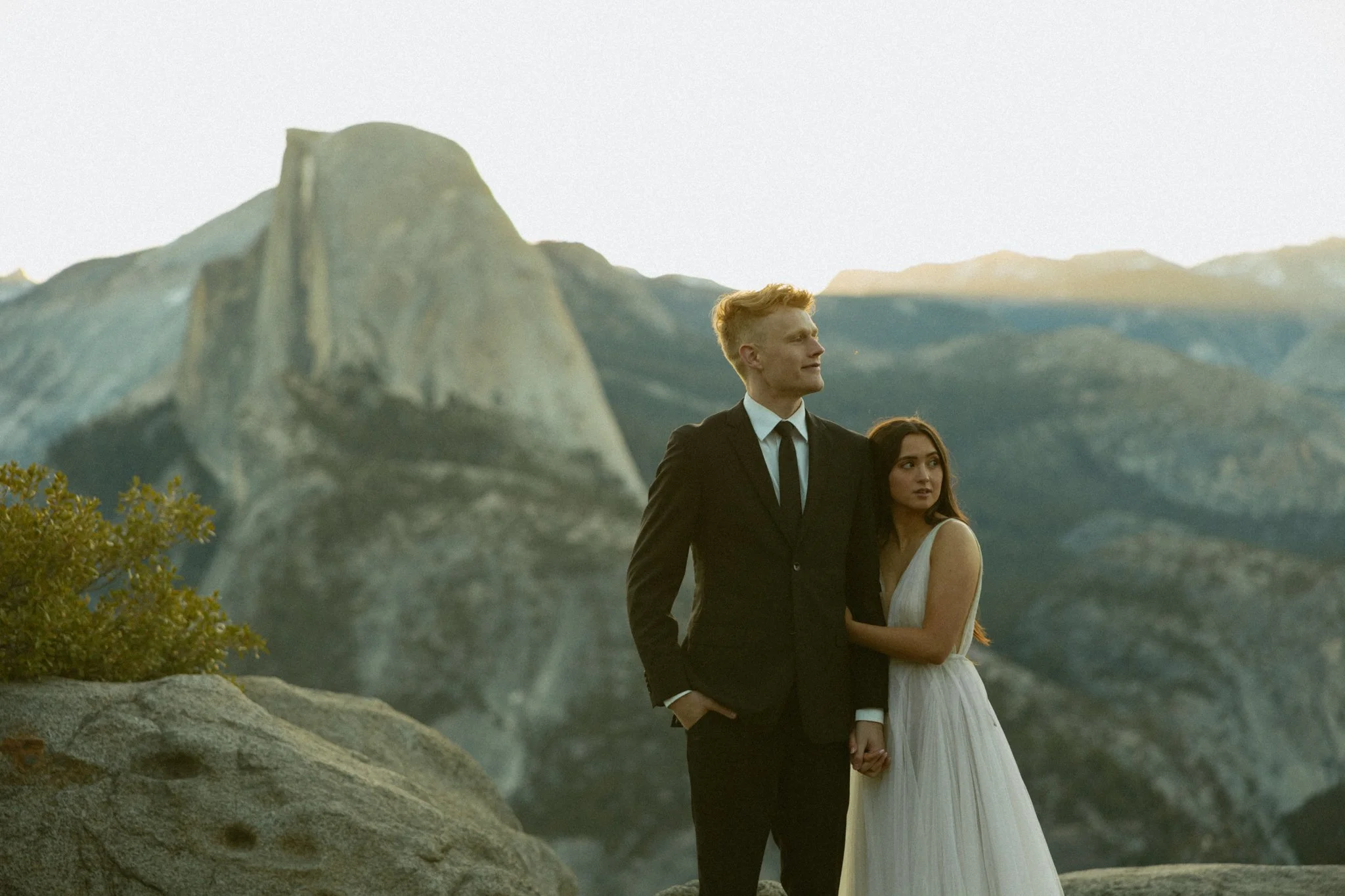 couple at glacier point in Yosemite national park on their elopement day