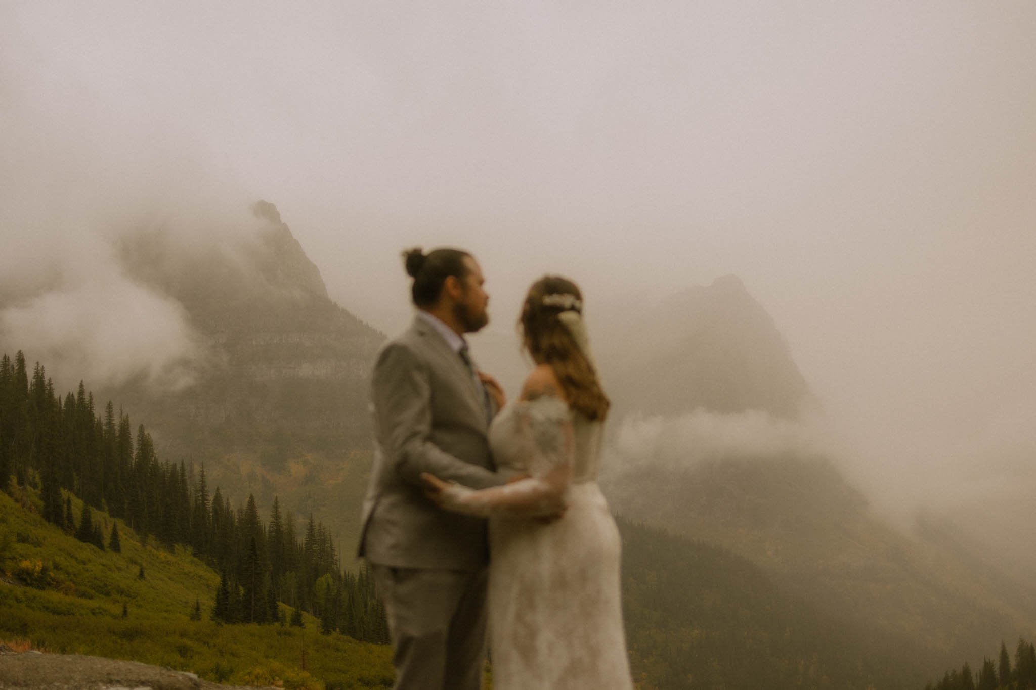 couple looking at mountains in Glacier National Park