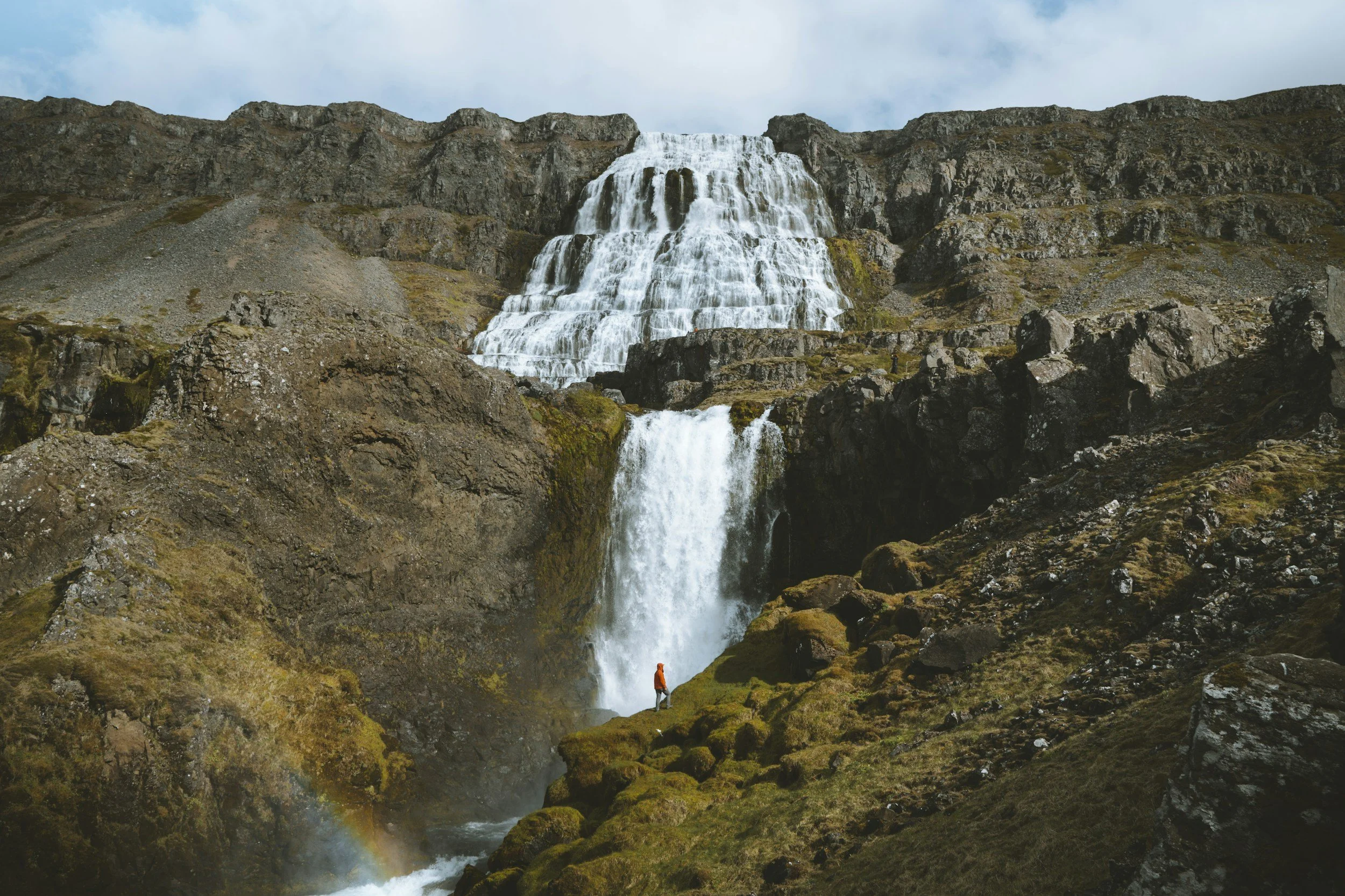 a landscape photo of a waterfall in the Westfjords of Iceland