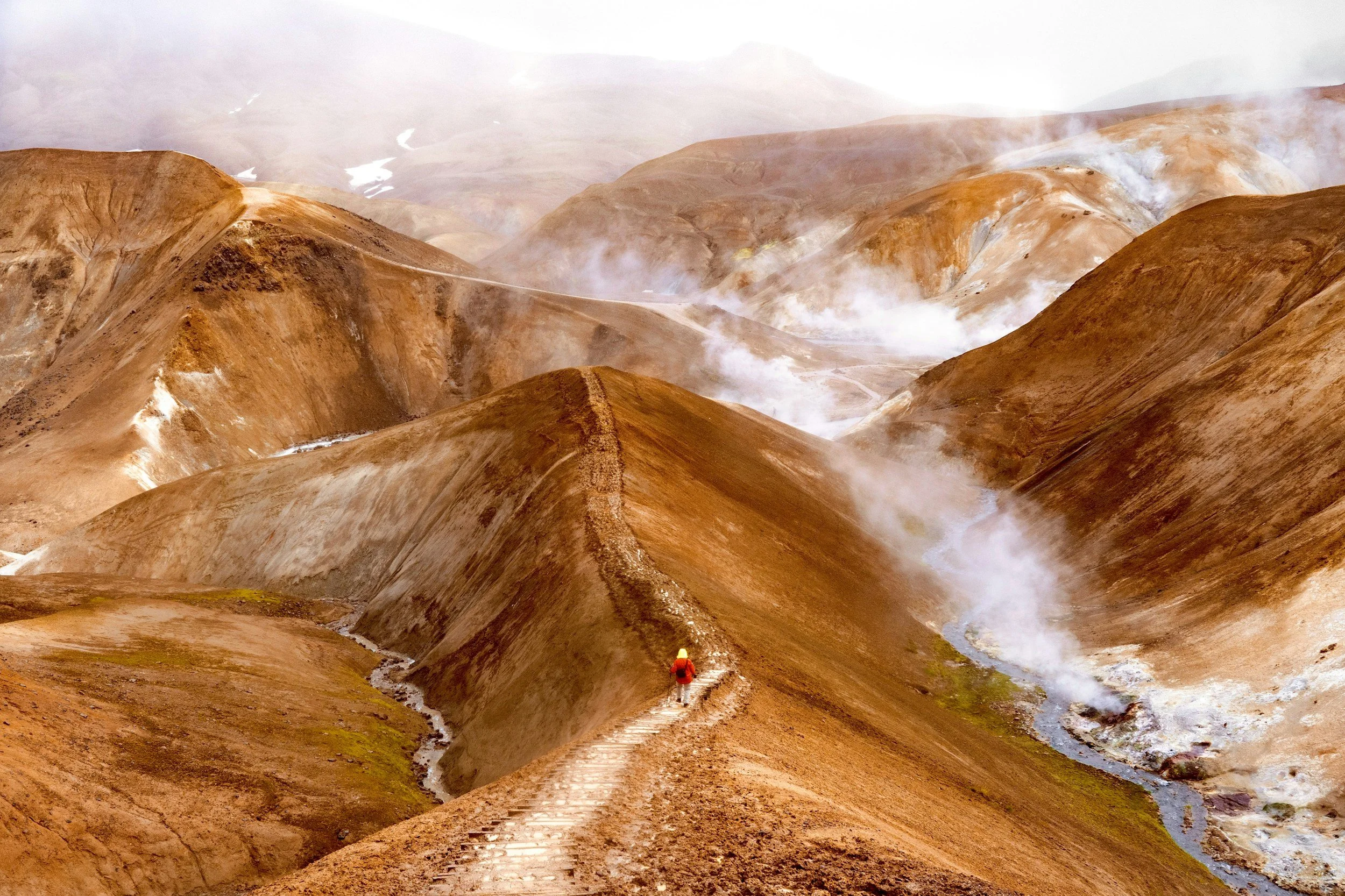 a landscape photo of a hiking trail located in the Highlands of Iceland