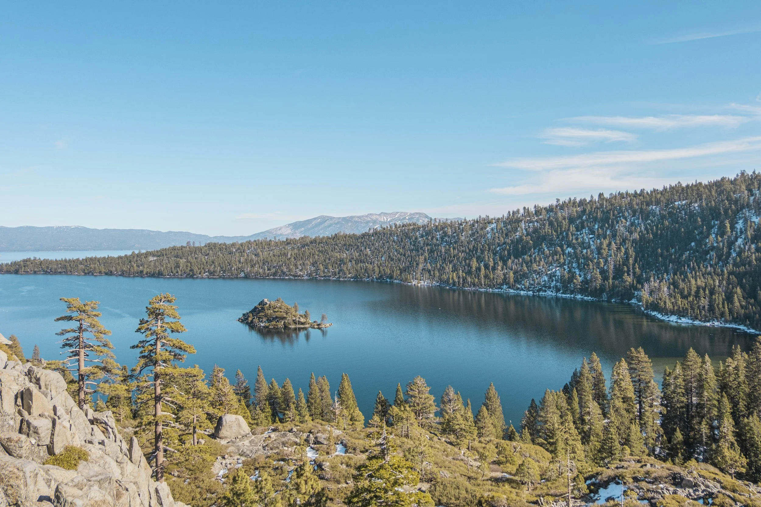 a landscape view of Lake Tahoe from a cliffside