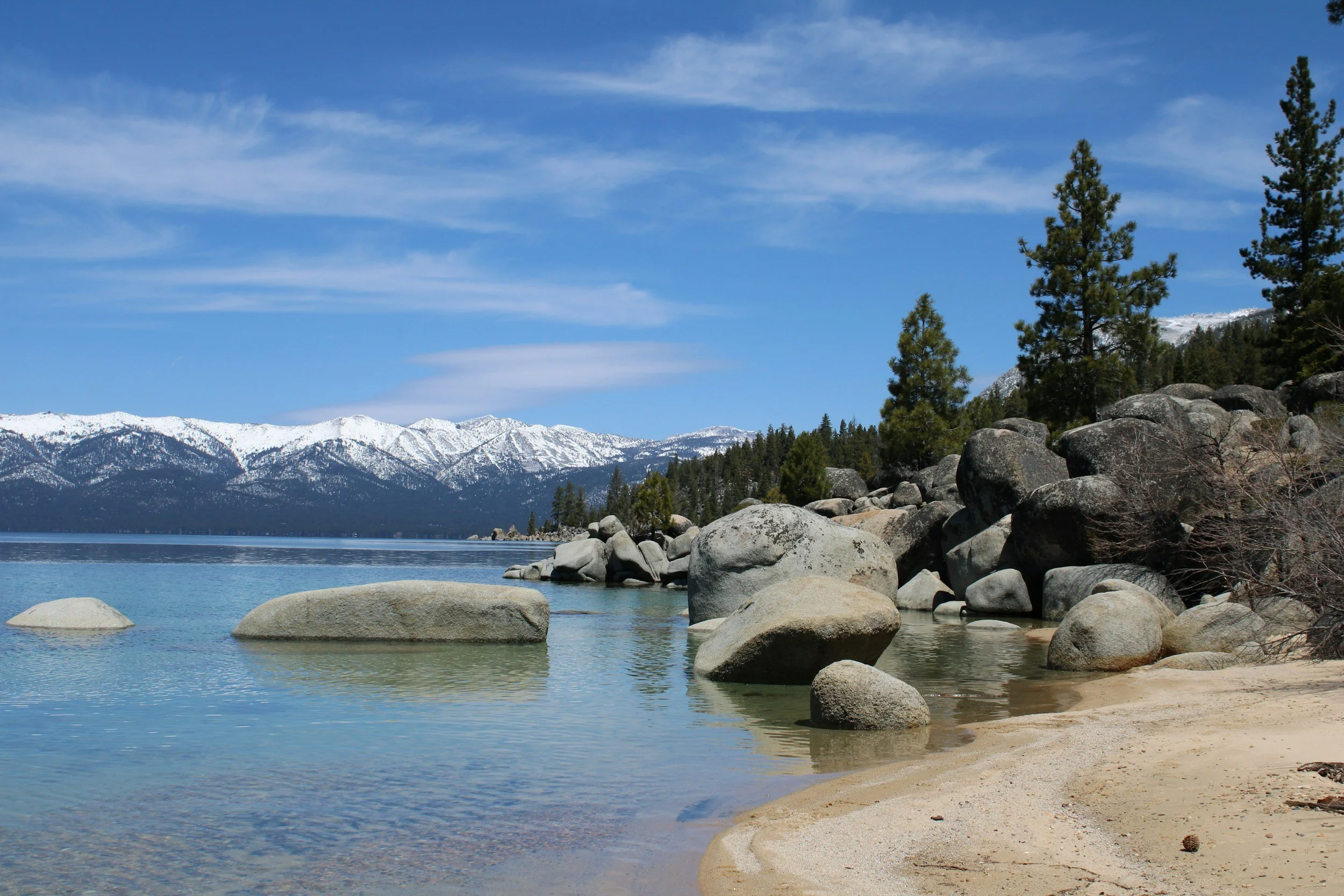 a landscape of the lake and mountains in the distance in Lake Tahoe, California