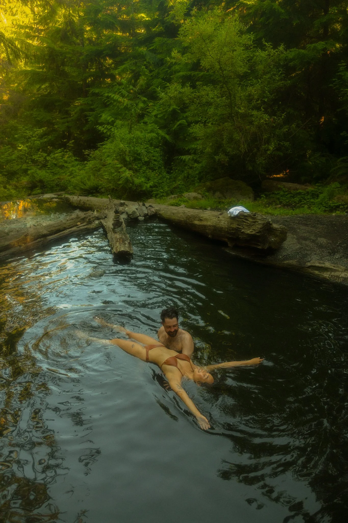  a couple getting married along an alpine lake in the North Cascades then soaking in a natural hot springs 