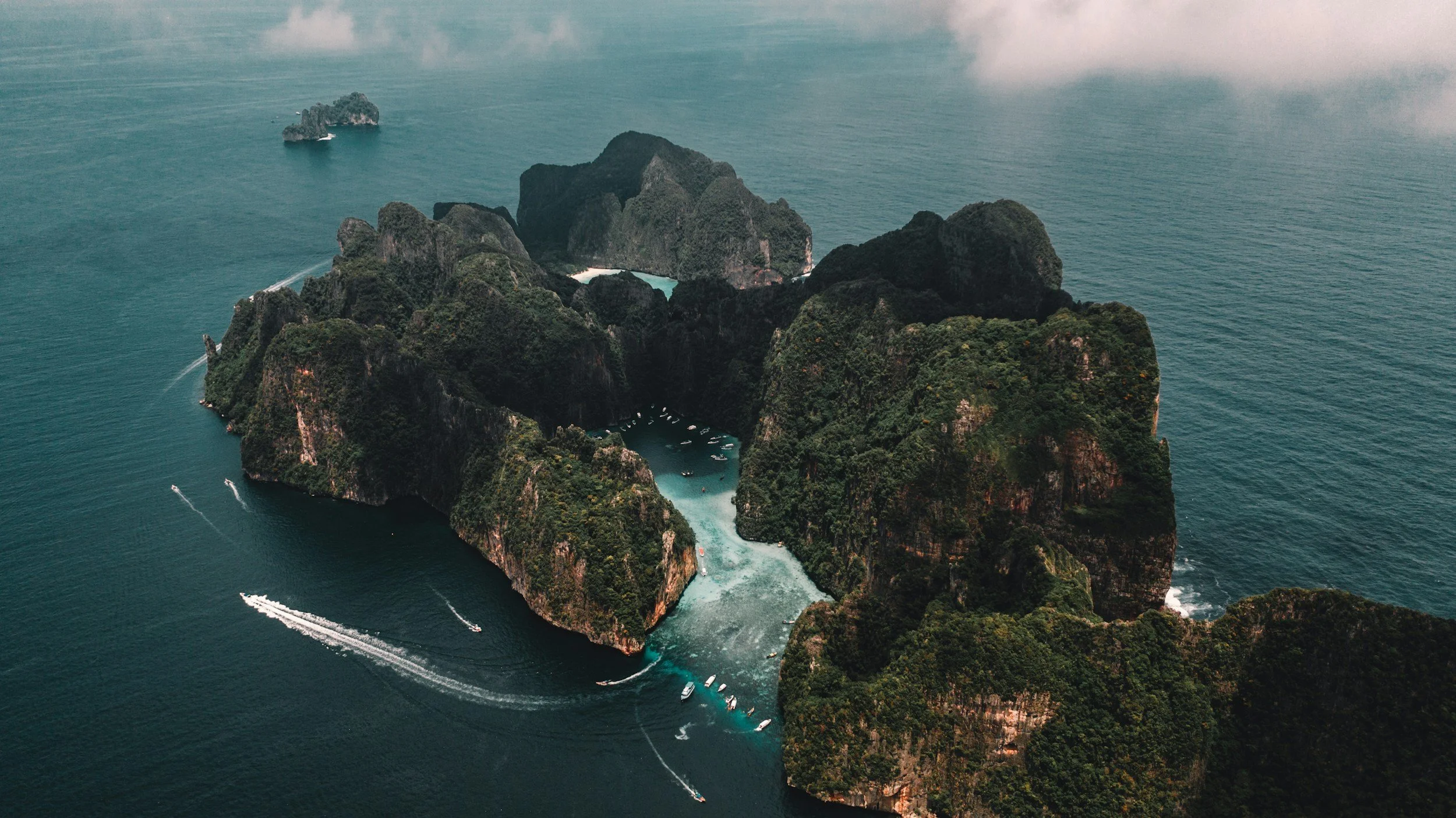 an aerial photo of the Phi Phi Islands in Thailand