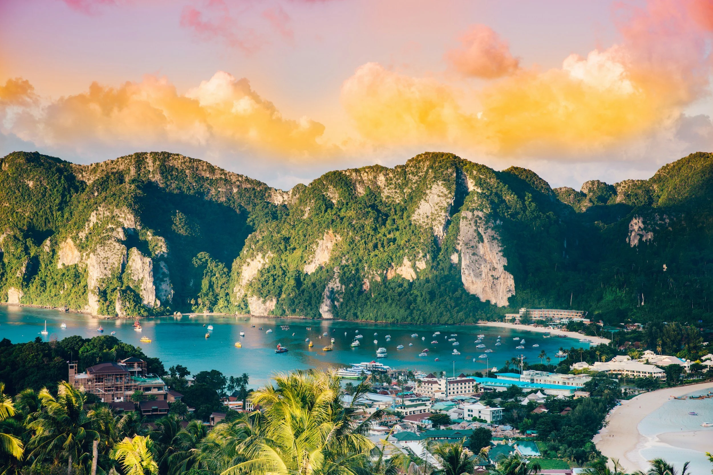 a landscape of a boat harbor with a Mountain View in Thailand