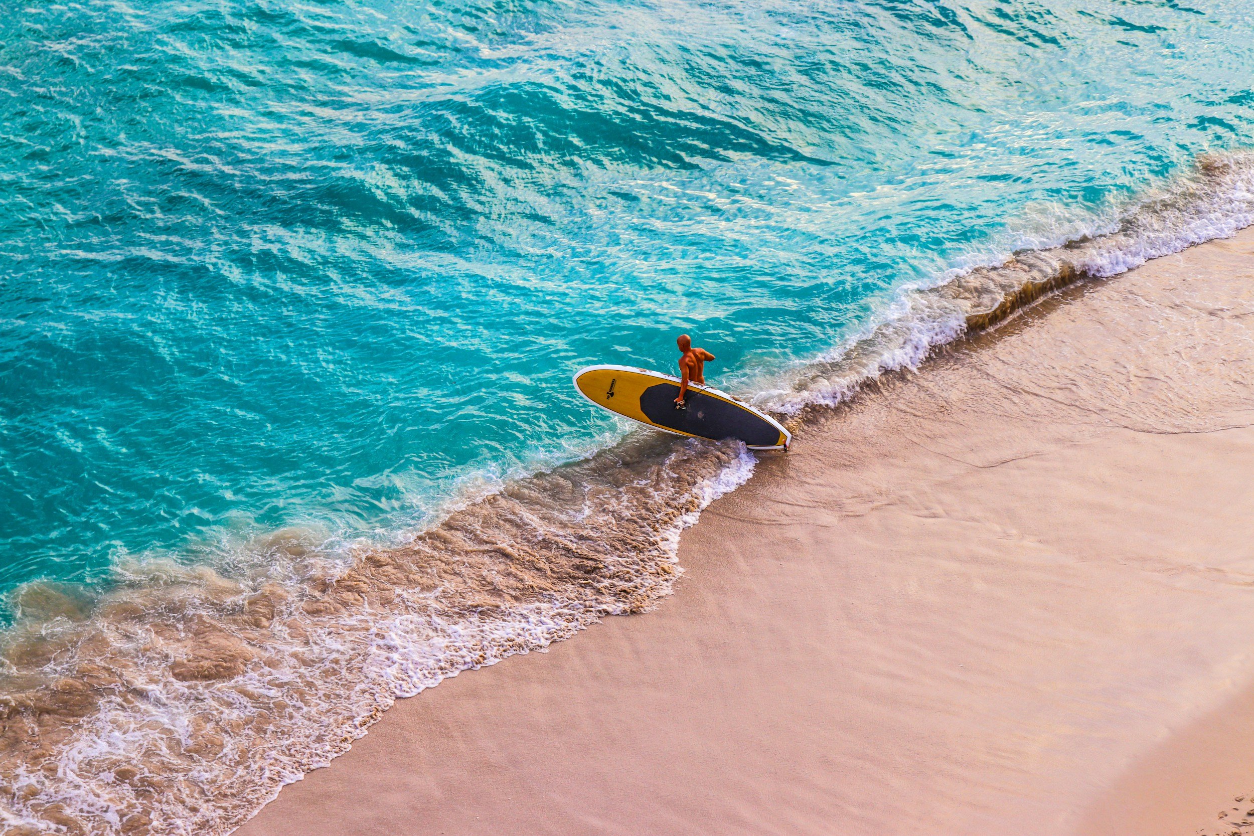 a person surfing on Oahu, Hawaii