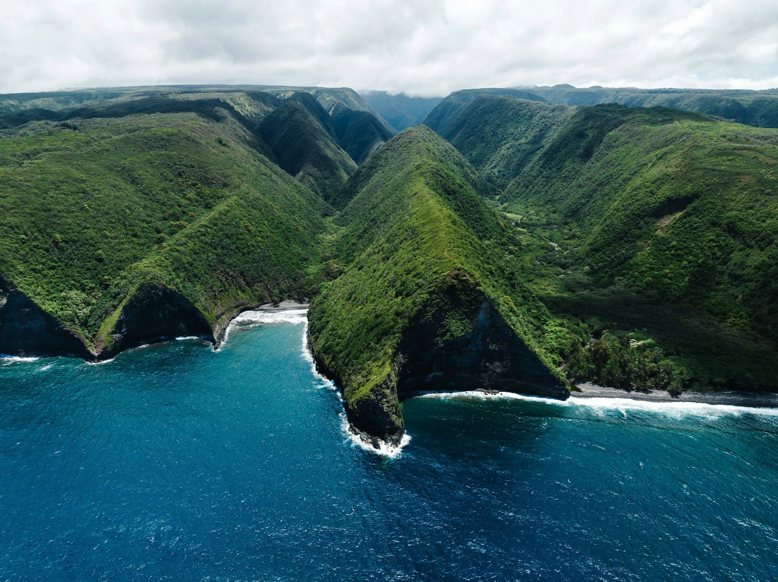 an aerial view of the coastline on the Big Island of Hawaii