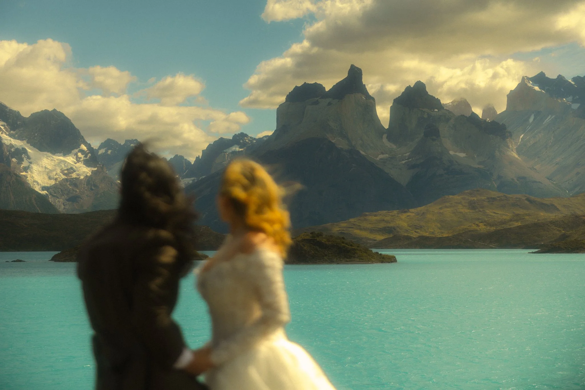 a couple eloping along Lago Pehoe in Torres del Paine National Park in the Chile side of Patagonia
