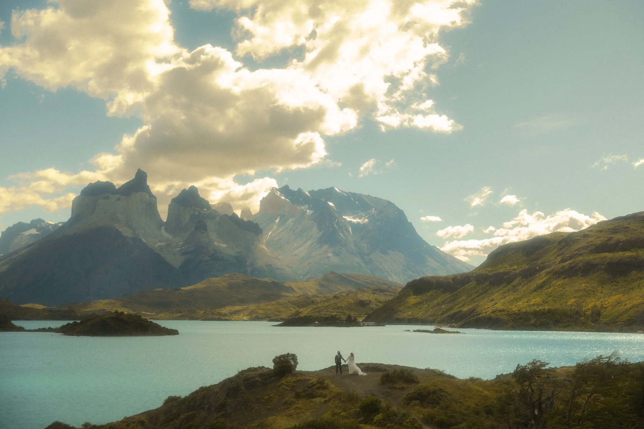 a couple eloping along Lago Pehoe in Torres del Paine National Park in the Chile side of Patagonia