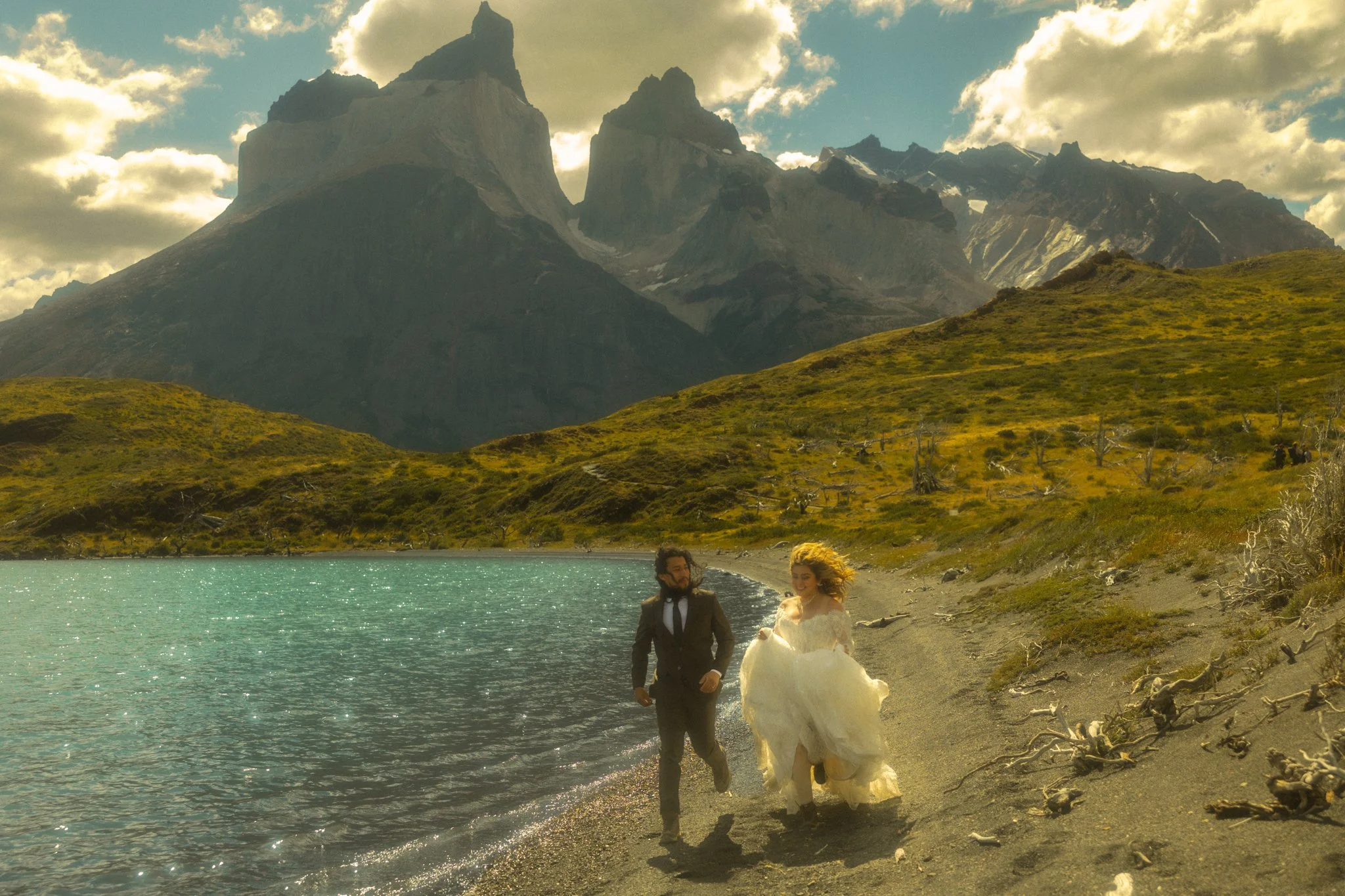 a couple eloping along Lago Pehoe in Torres del Paine National Park in the Chile side of Patagonia