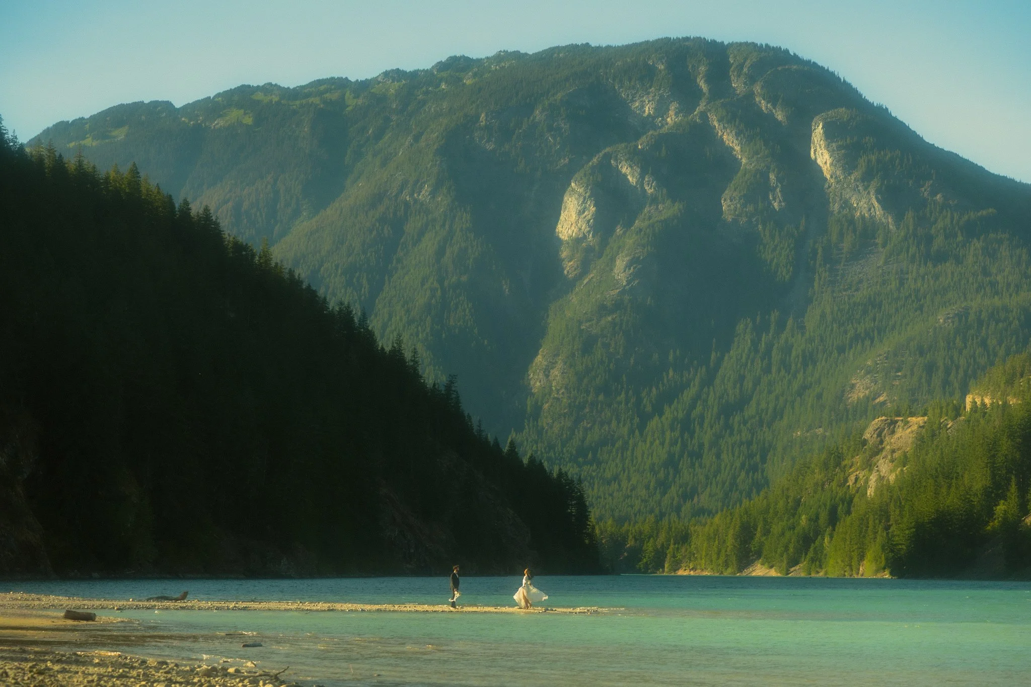 a couple getting married along an alpine lake in the North Cascades then soaking in a natural hot springs