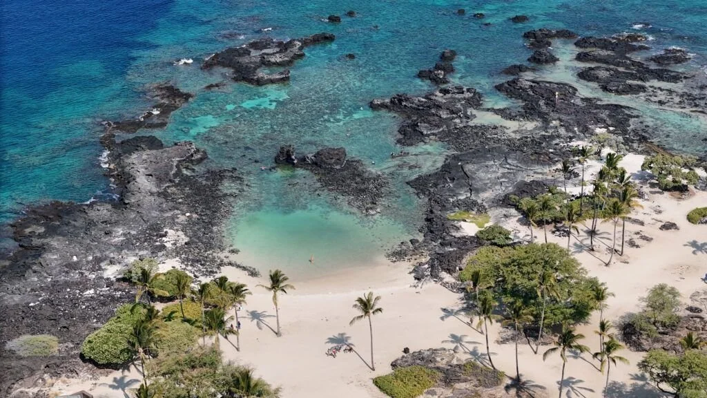 an aerial photo of Kukio Beach on the Big Island of Hawaii