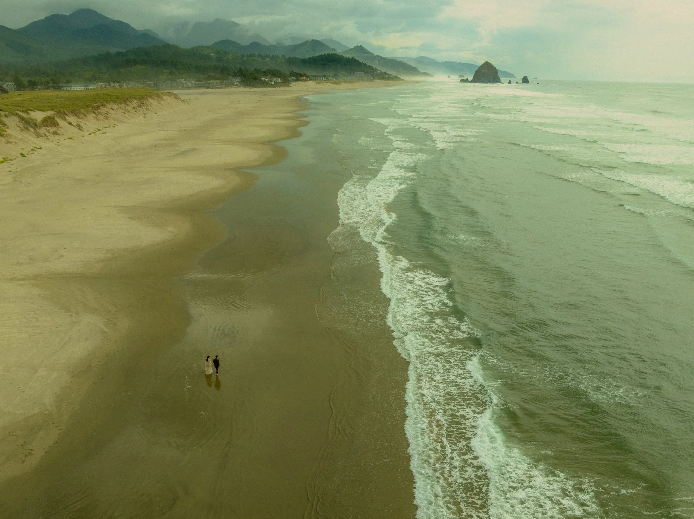 a couple eloping along the Oregon Coast with a vintage romance aesthetic