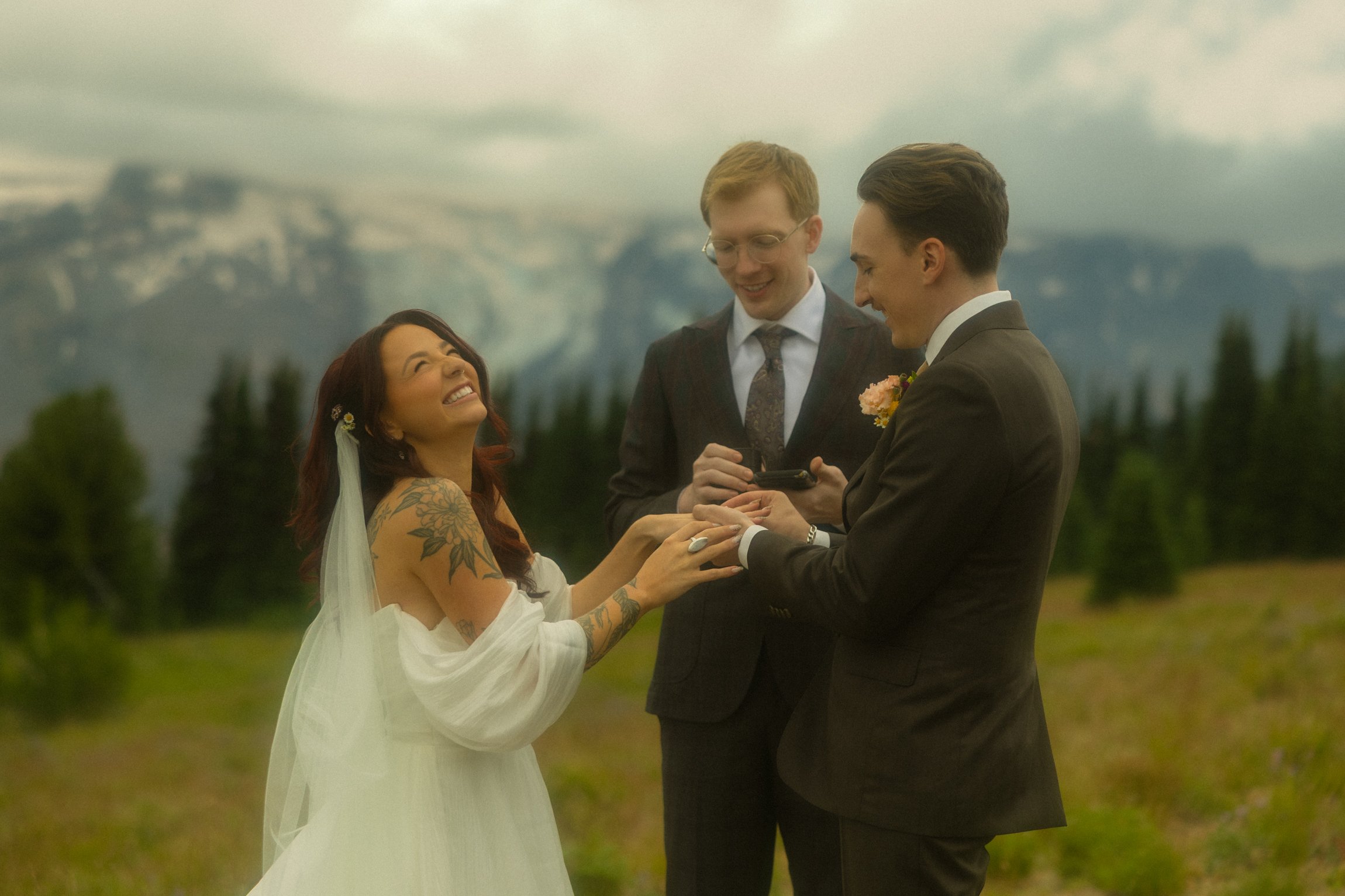 a couple getting married in Washington’s Mt Rainier National Park during peak wildflower season in the summer