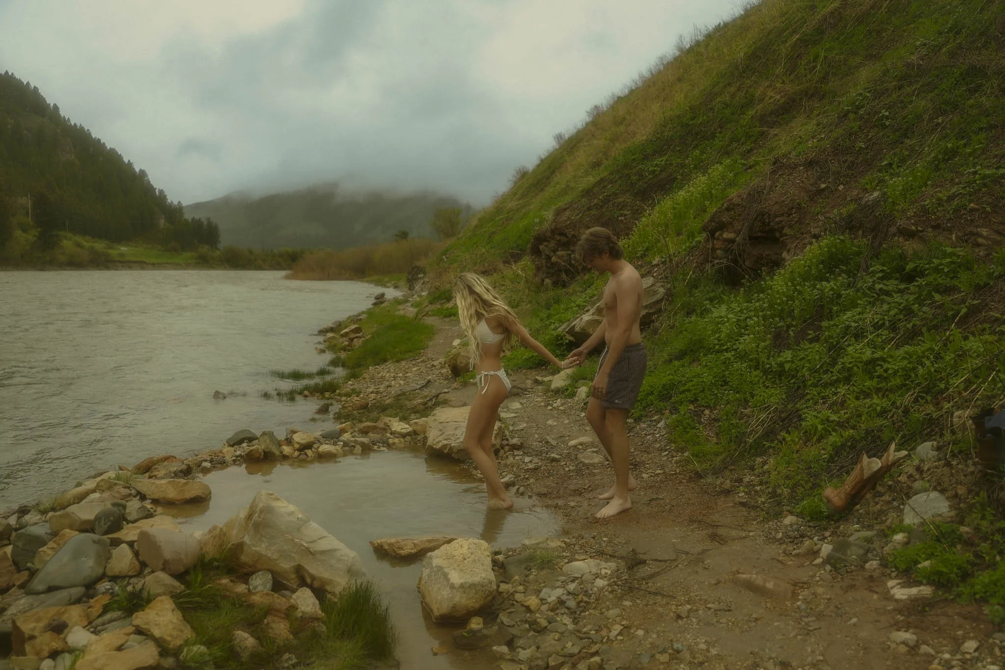 A couple enjoying a hot spring after their elopement ceremony