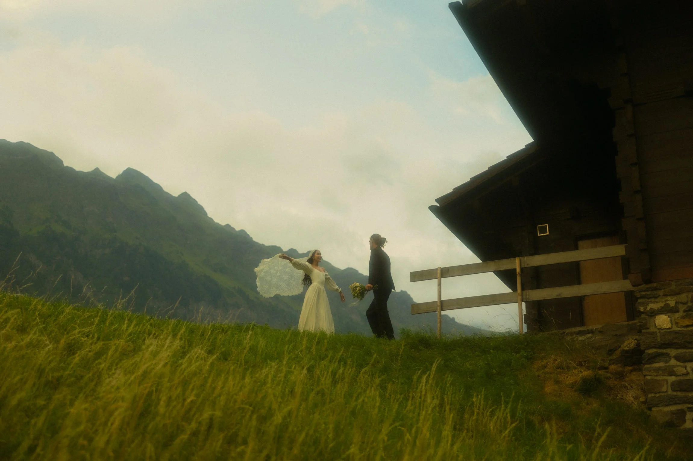 a couple eloping in Switzerland next to a Chalet