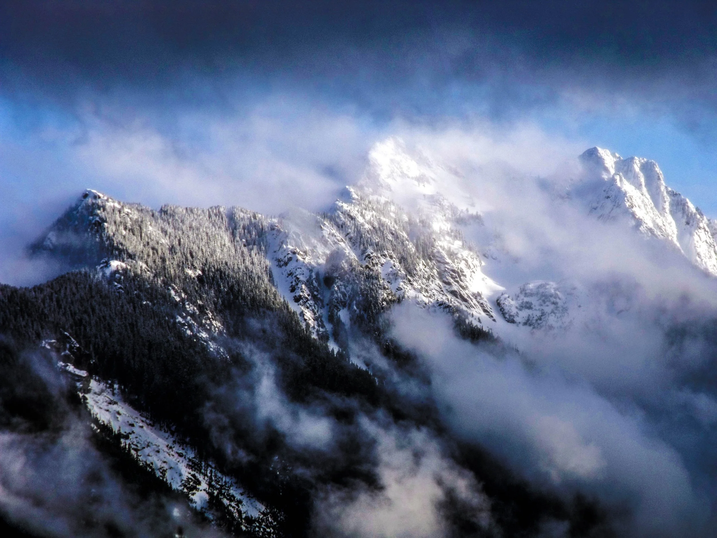 "Above the Clouds"
The peaks emerge through what obscures them, revealed only in part. What rises this high is never fully seen.
