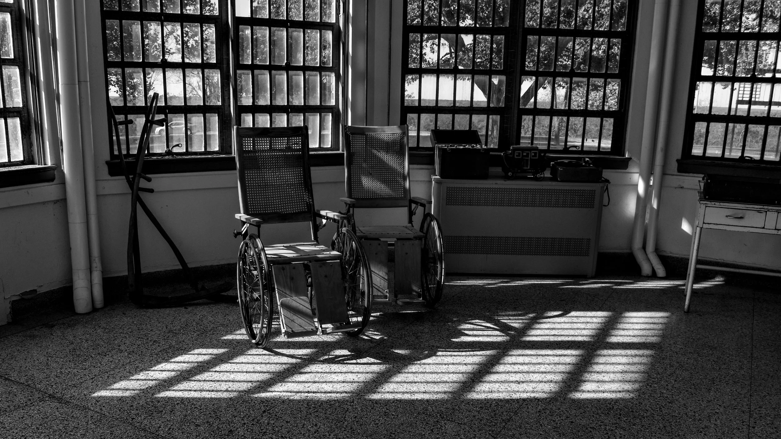 "After Use"
Chairs sit in borrowed light, arranged for something that already passed. The room holds the shape of it.