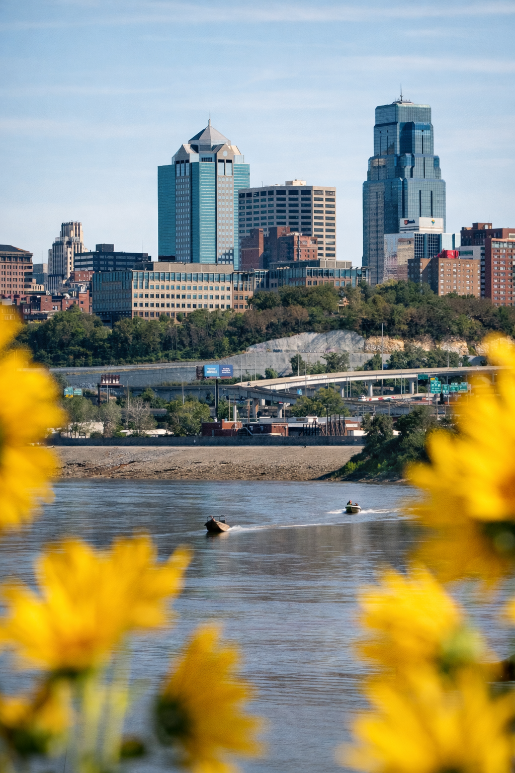 "Framed by Growth"
The skyline rises beyond what blooms in front of it, held between what we build and what continues to grow. Neither exists without the other.