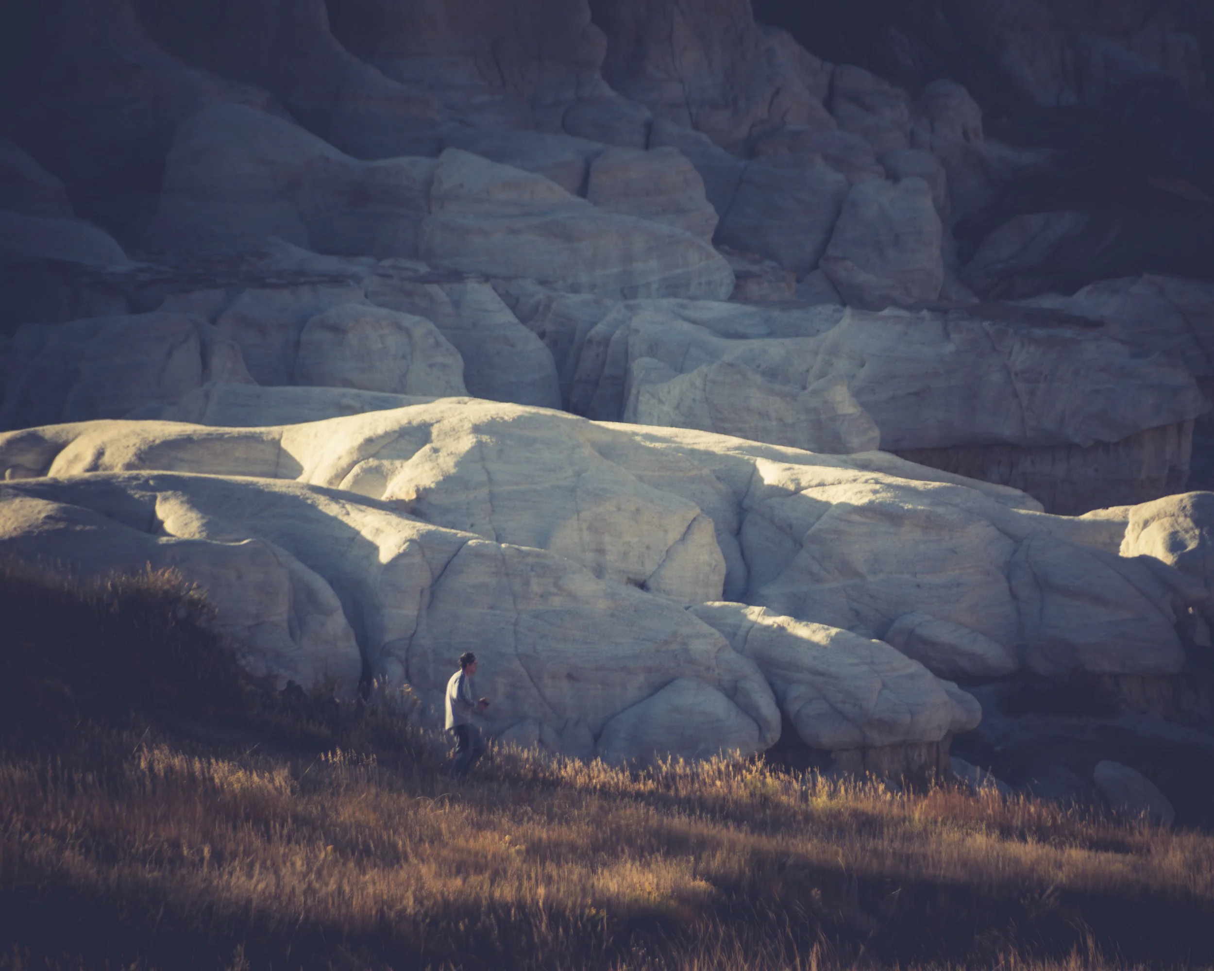 "Resting Place"
They sit among the carved stone, surrounded by what endures longer than they will. The moment feels small against it.