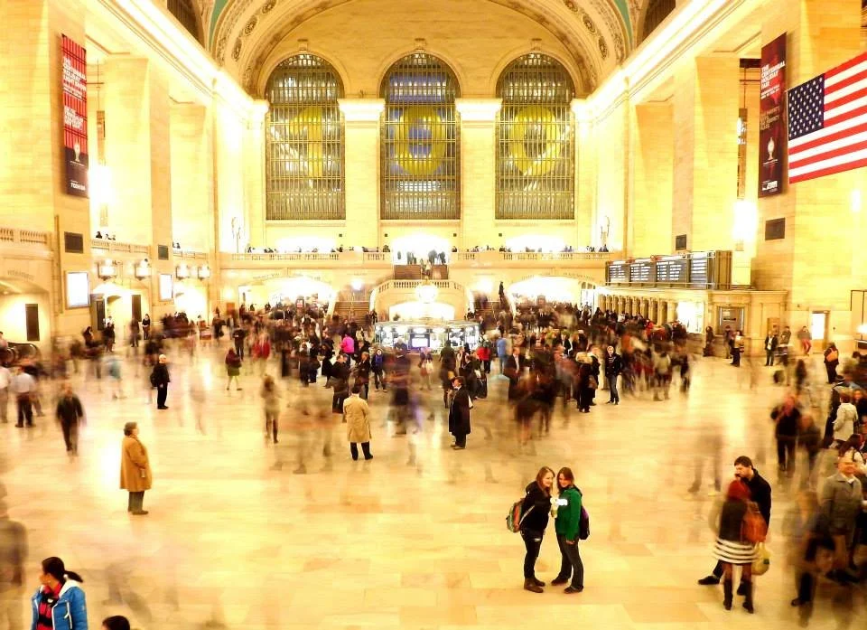 "Moving Through"
They pass beneath the vast interior, each absorbed in their own direction. The moment belongs to many—but not shared.