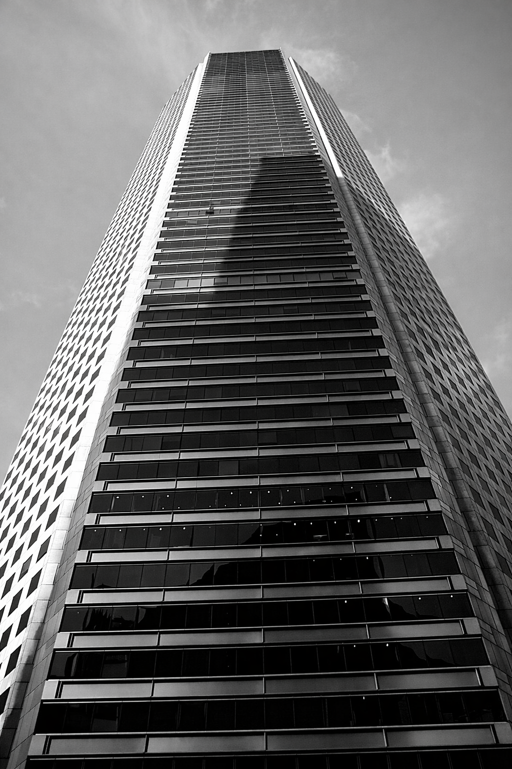 "Shadowed Height"
The building rises to meet the frame, its surface holding both light and shadow. What we build reaches upward—but never alone.