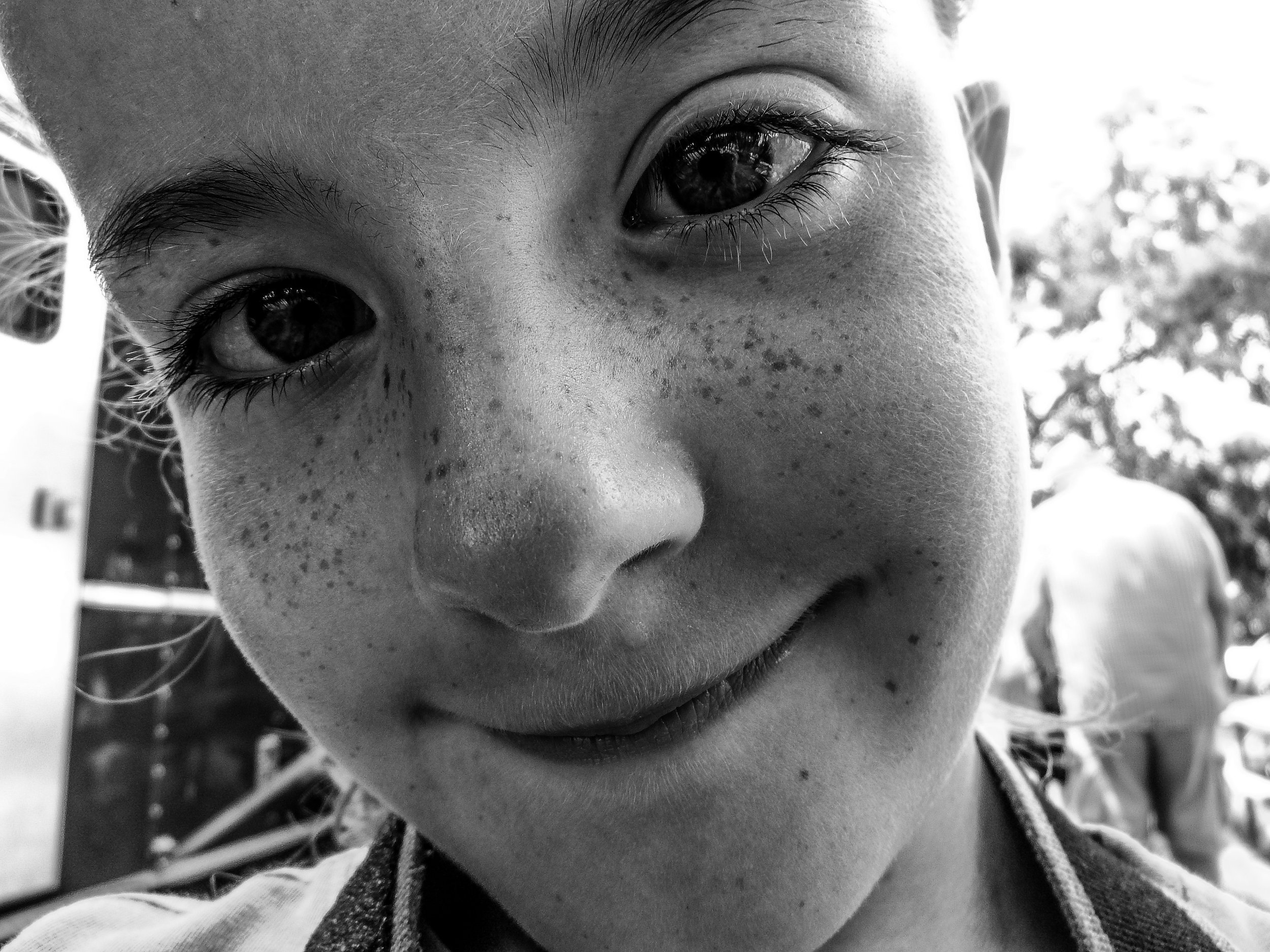 "Close Enough to See"
She meets the frame without distance, every detail unguarded. The moment is given, not taken.