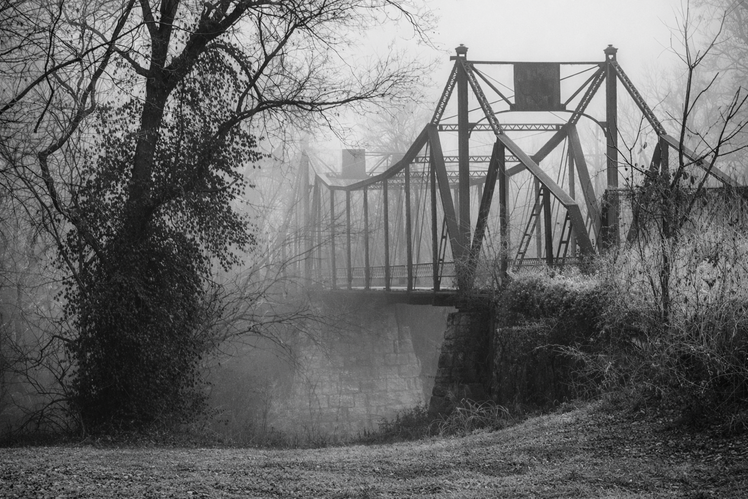 "Still Bearing"
The bridge stands in quiet endurance, built for passage now mostly gone. Its purpose lingers in structure alone.