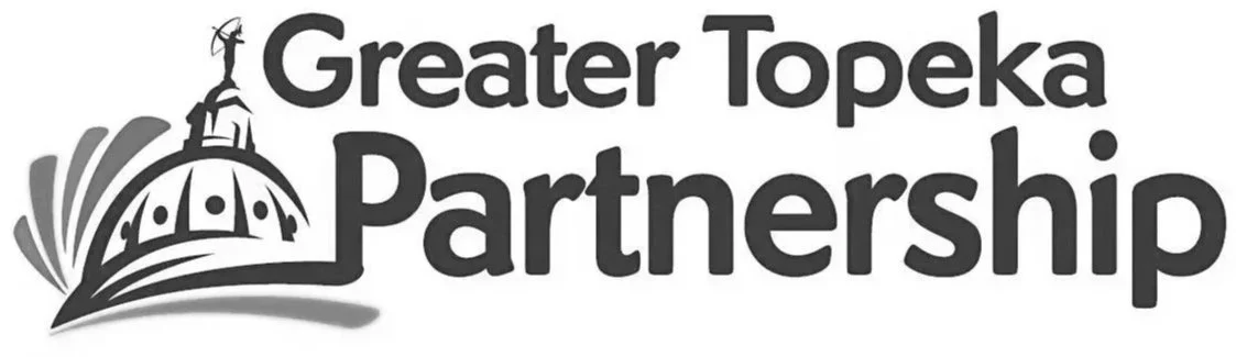 Logo of Greater Topeka Partnership with a stylized city skyline and a dome dome structure.
