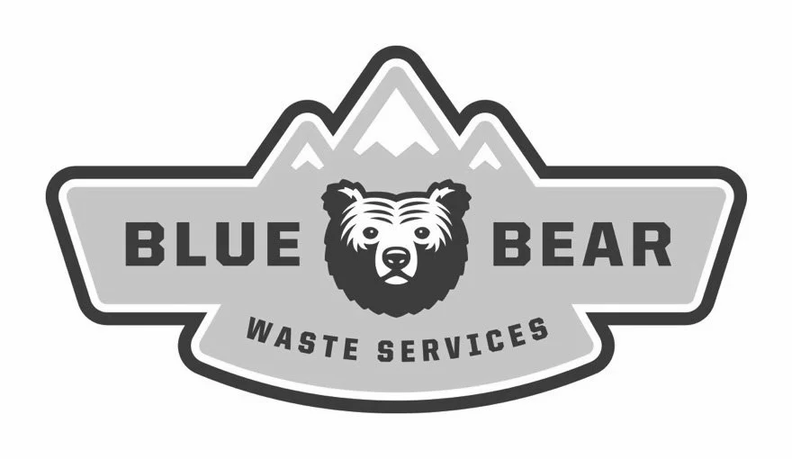 Logo for Blue Bear Waste Services featuring a bear's face, mountain peaks, and text.