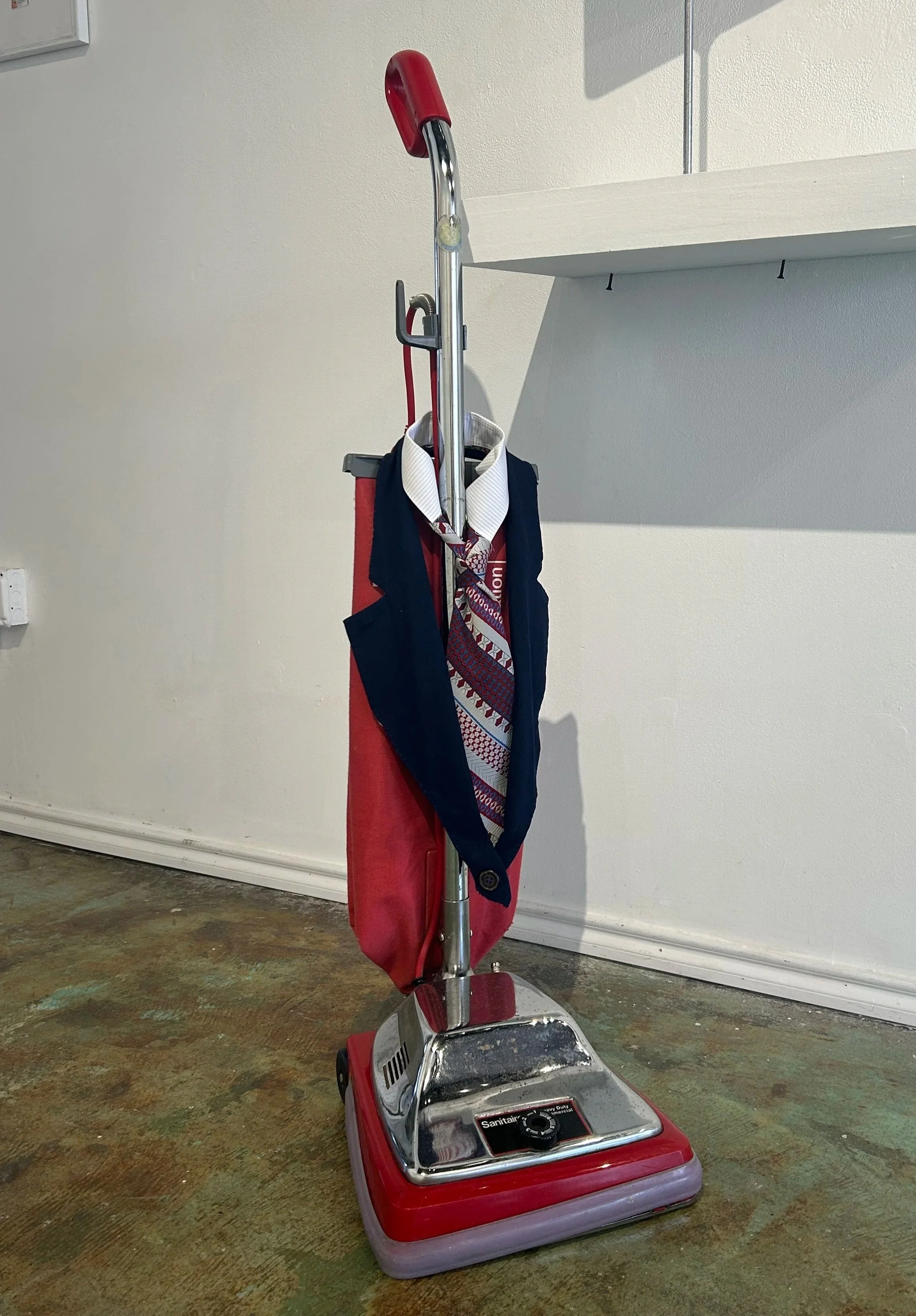 "This really suits you!", 40in x 16in x 14in, Vacuum, fabric, thread, and button, 2025- 2026
