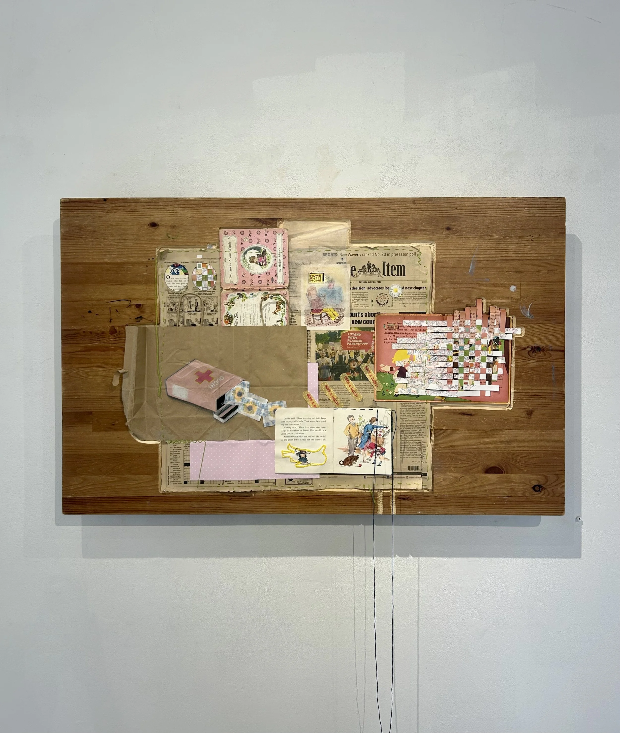 "Tabletop Discussion", 2025-2026, Wood, paper, dryer sheet, thread, needle, band-aids, 42.5in x 29.5in x 3in
