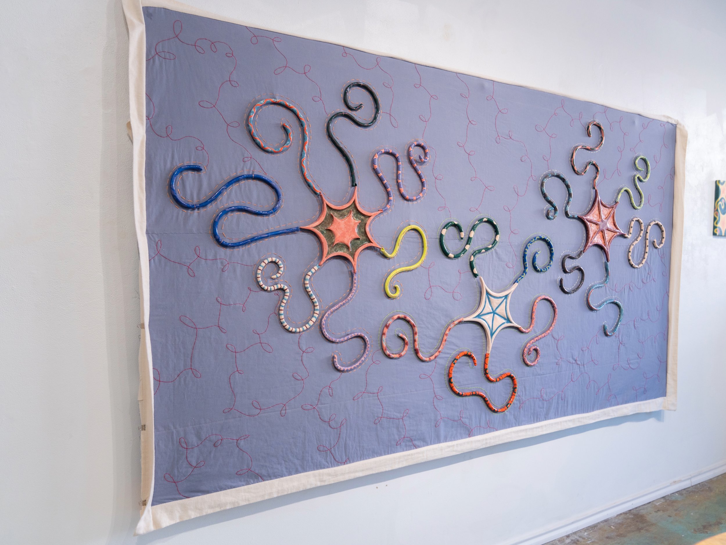 "Stardust" 2025-2026, Fabric, thread, and ceramic, magnets, 100in x 56in x 2in