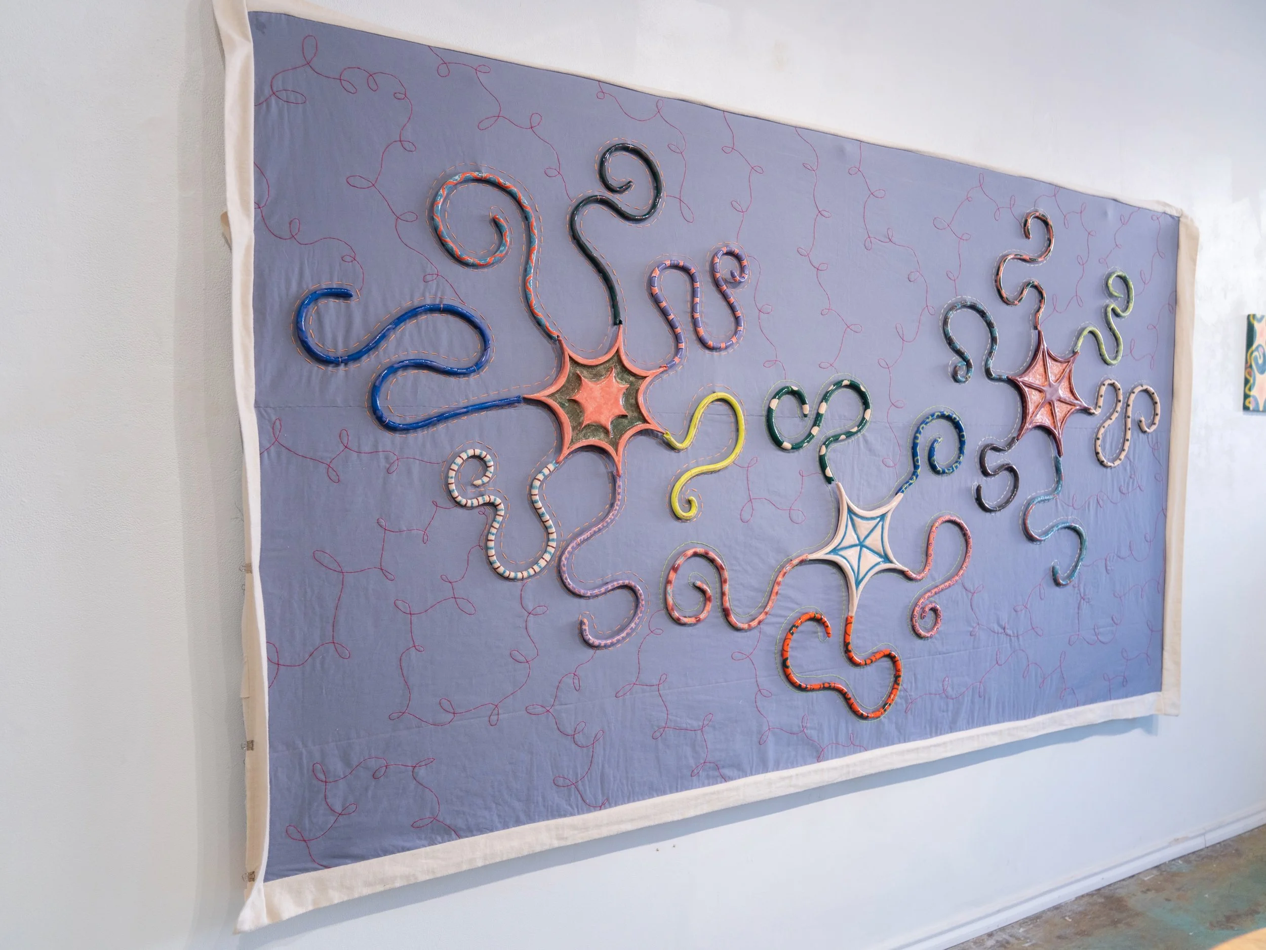 "Stardust" 2025-2026, Fabric, thread, and ceramic, magnets, 100in x 56in x 2in