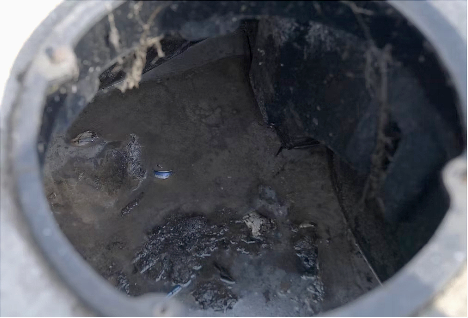 The inside of tank with heavy bio-mat buildup