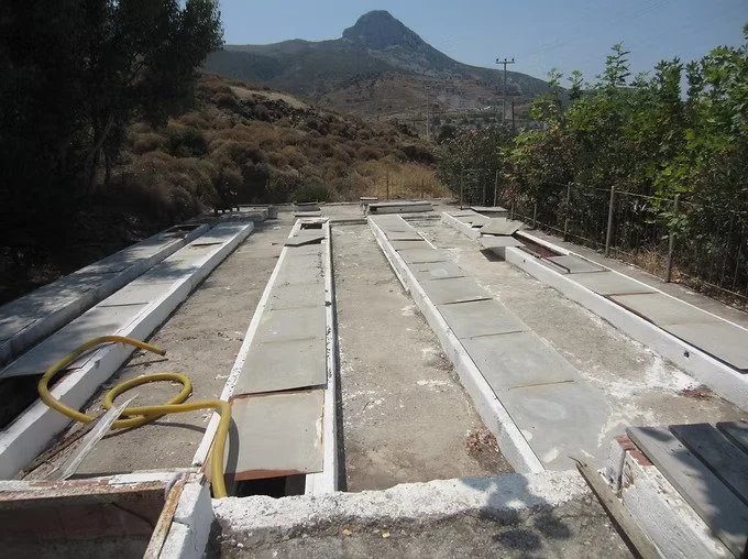 Wastewater Treatment plant with a mountainous landscape in the background
