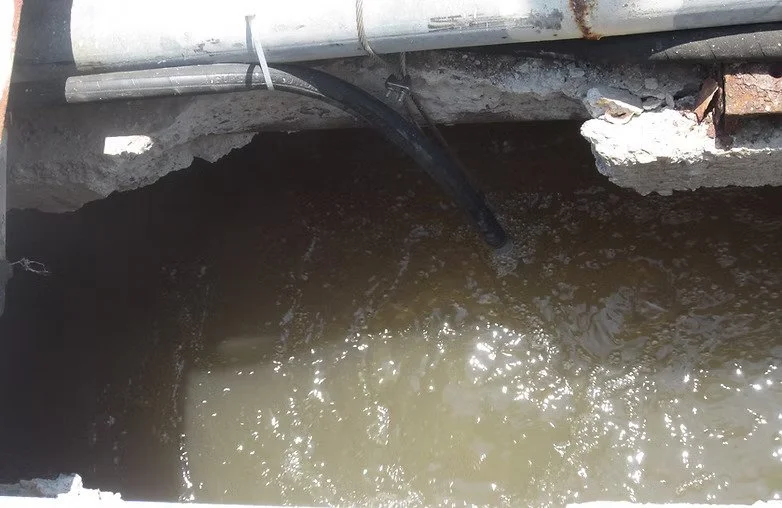 Close-up of a hole in a wastewater treatment plant basic