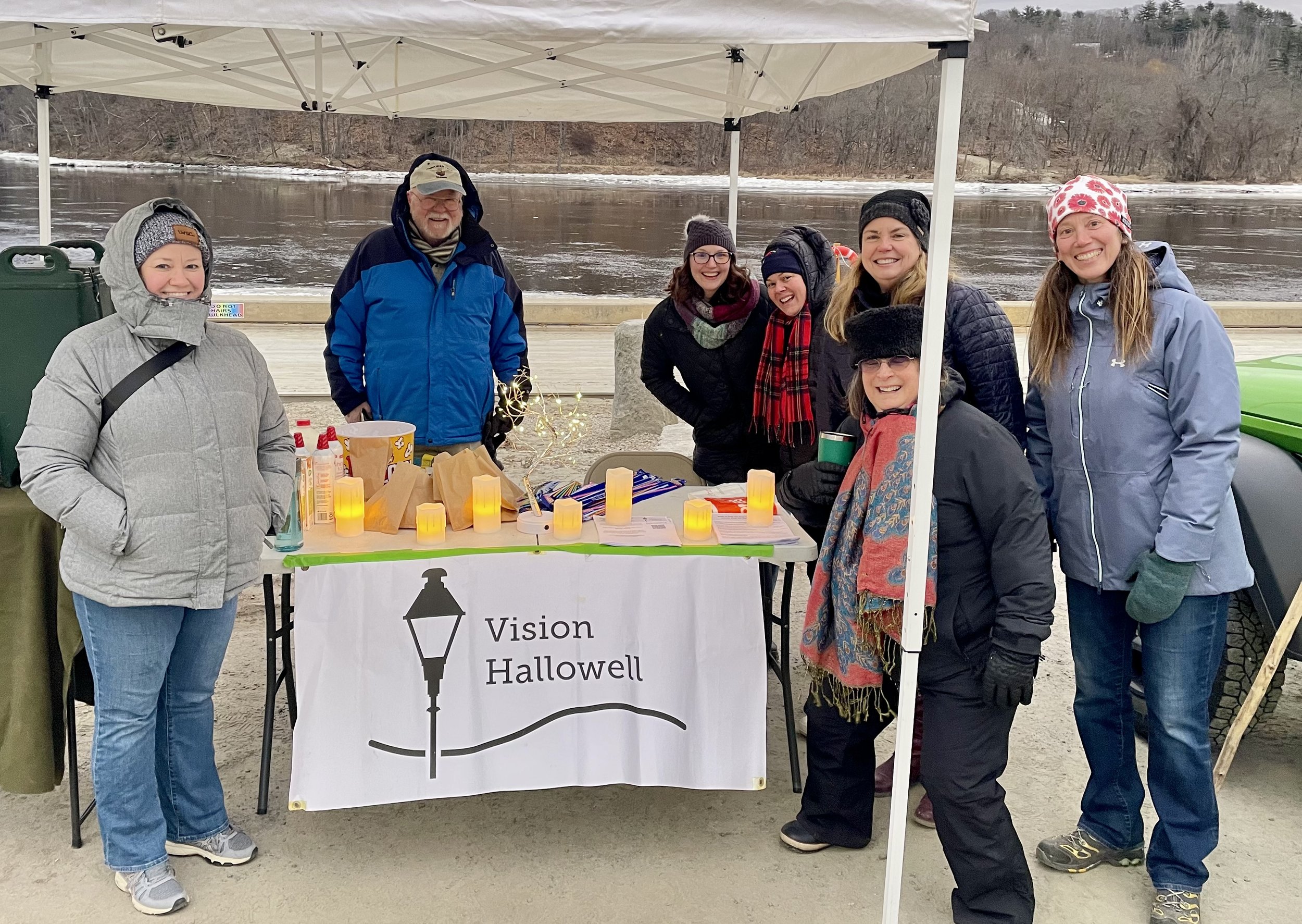 Image of Maureen AuCoin and members of Vision Hallowell, a community group supporting Downtown Hallowell. They are hosting a fundraiser for the Hallowell Fire Department.