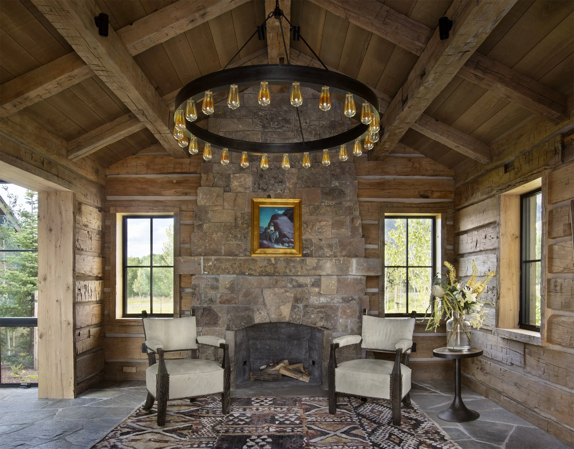 LCR-13-reclaimed-log-sitting-room-stone-fireplace.jpg