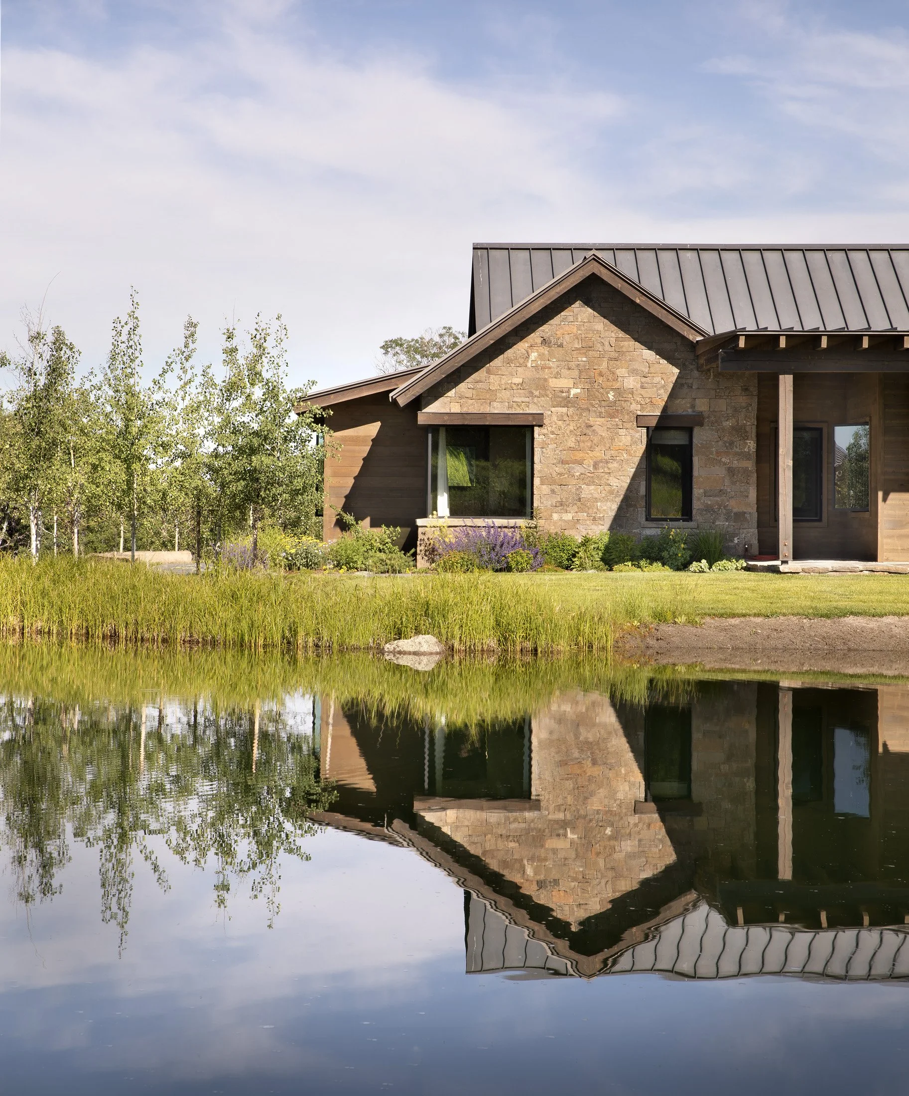 LCR-17-stone-home-pond-reflection-exterior.jpg