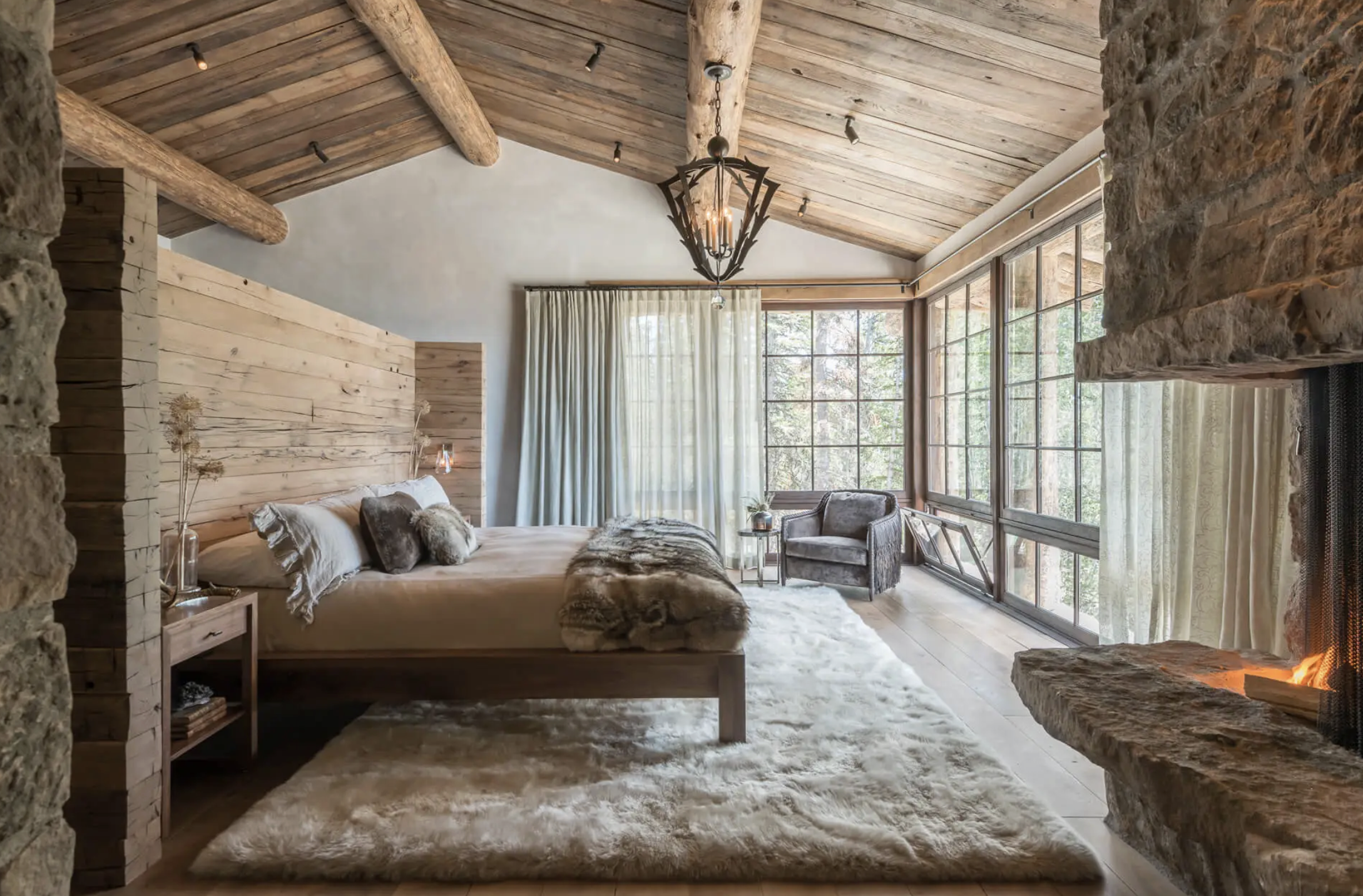 FL-06-master-bedroom-window-wall-stone-fireplace.png