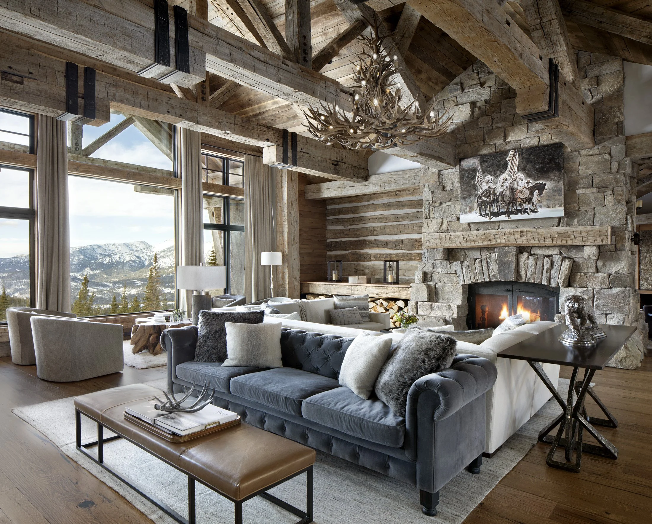 Great room with large windows capturing mountain views and timber structure in Big Sky Montana
