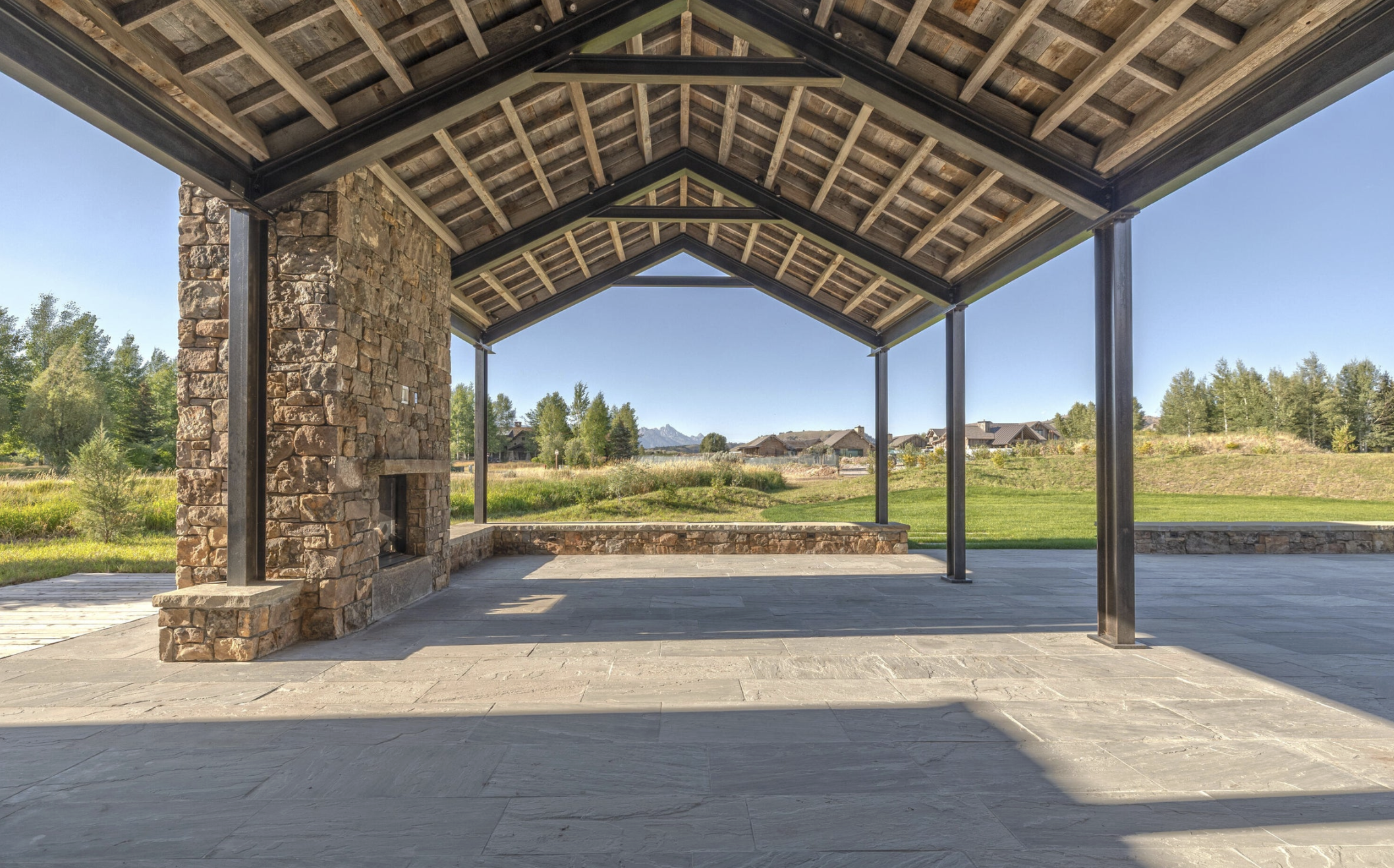 MP-25-covered-outdoor-living-stone-fireplace.png