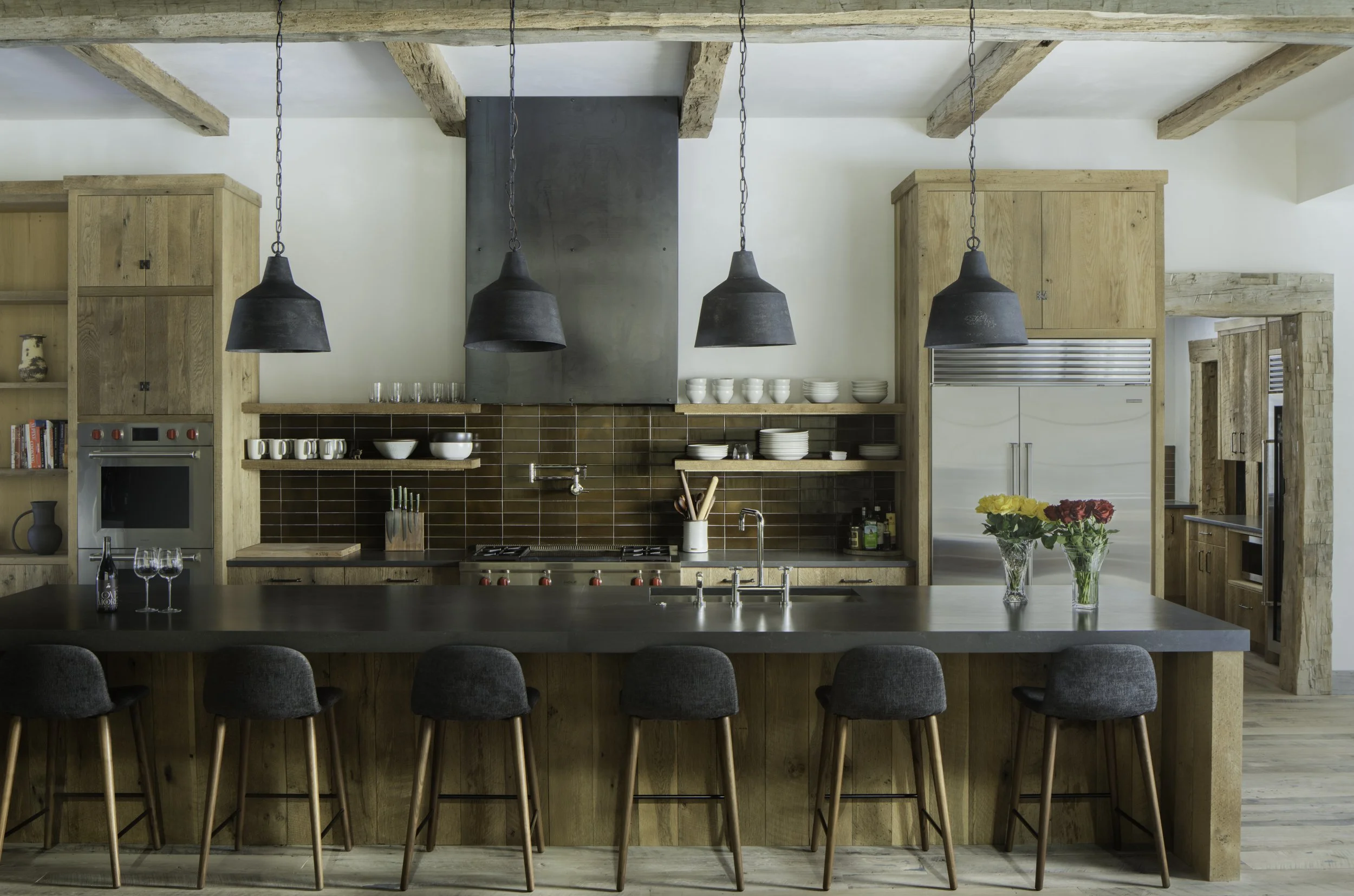 Wide mid century kitchen view with island and bar seating in Big Sky Montana