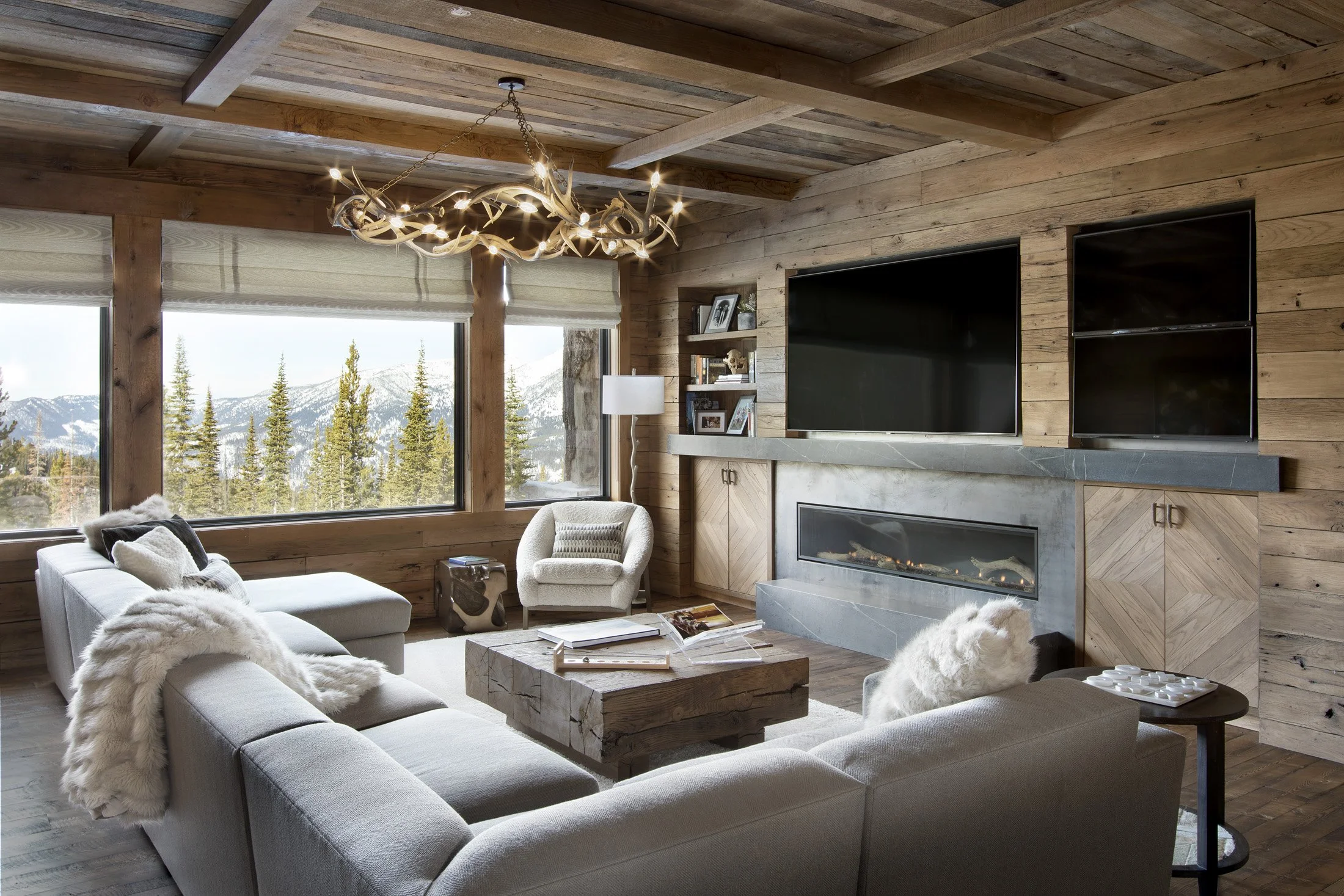 Family room with fireplace, built-in media wall, and mountain views