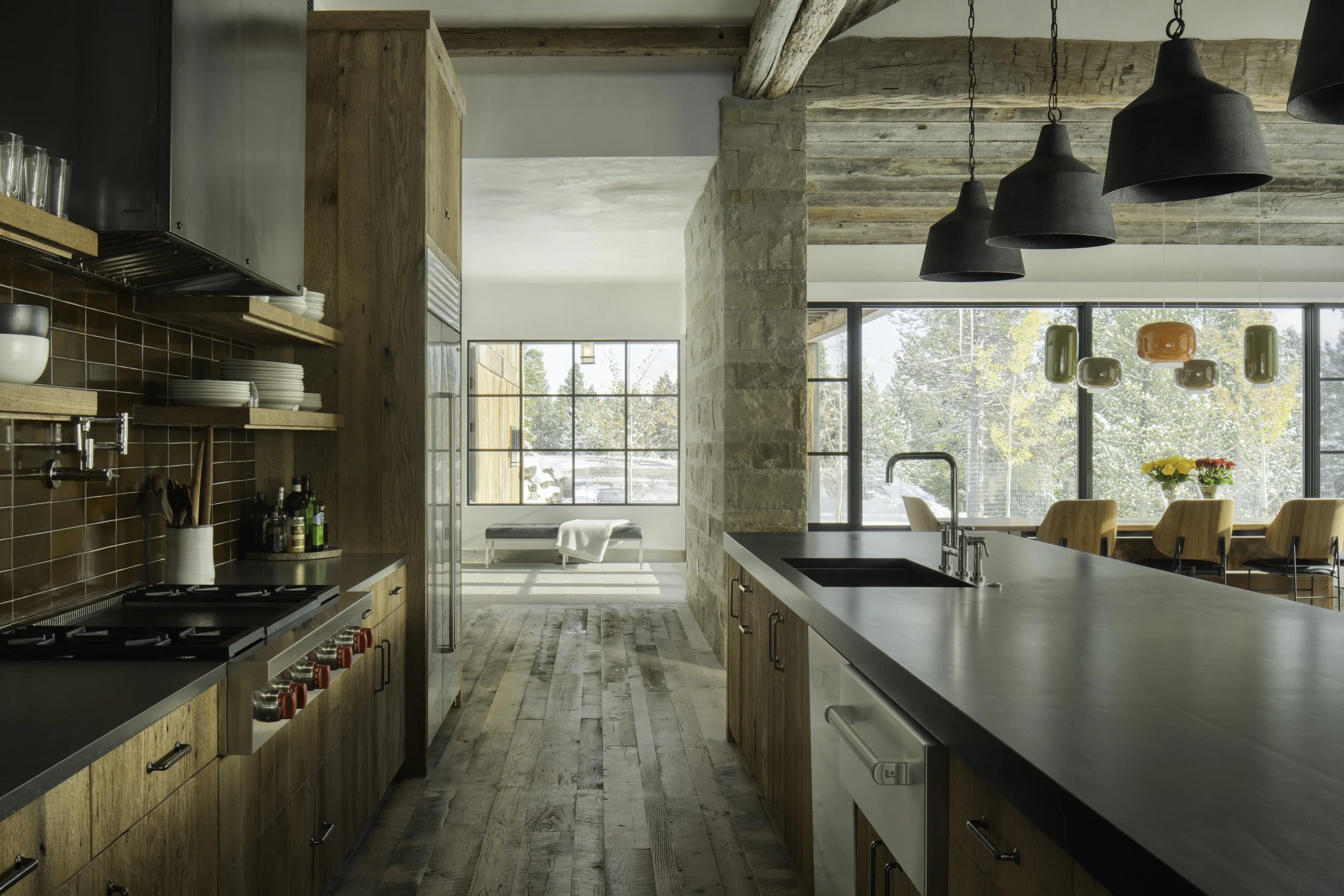 Kitchen galley view into the dining and outdoors in Big Sky Montana