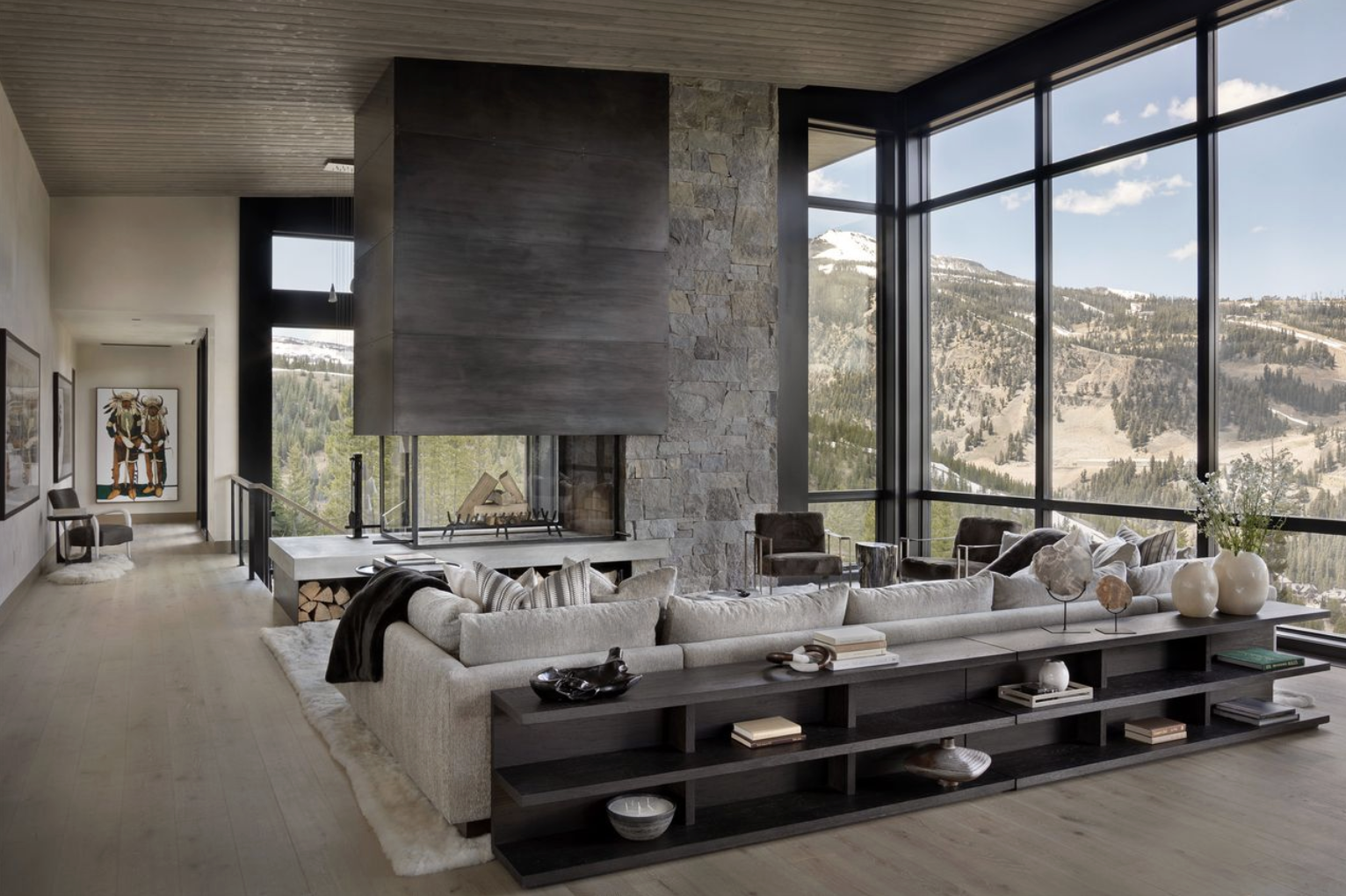 HW-11-great-room-stone-steel-fireplace-floor-to-ceiling-windows-yellowstone-club.png