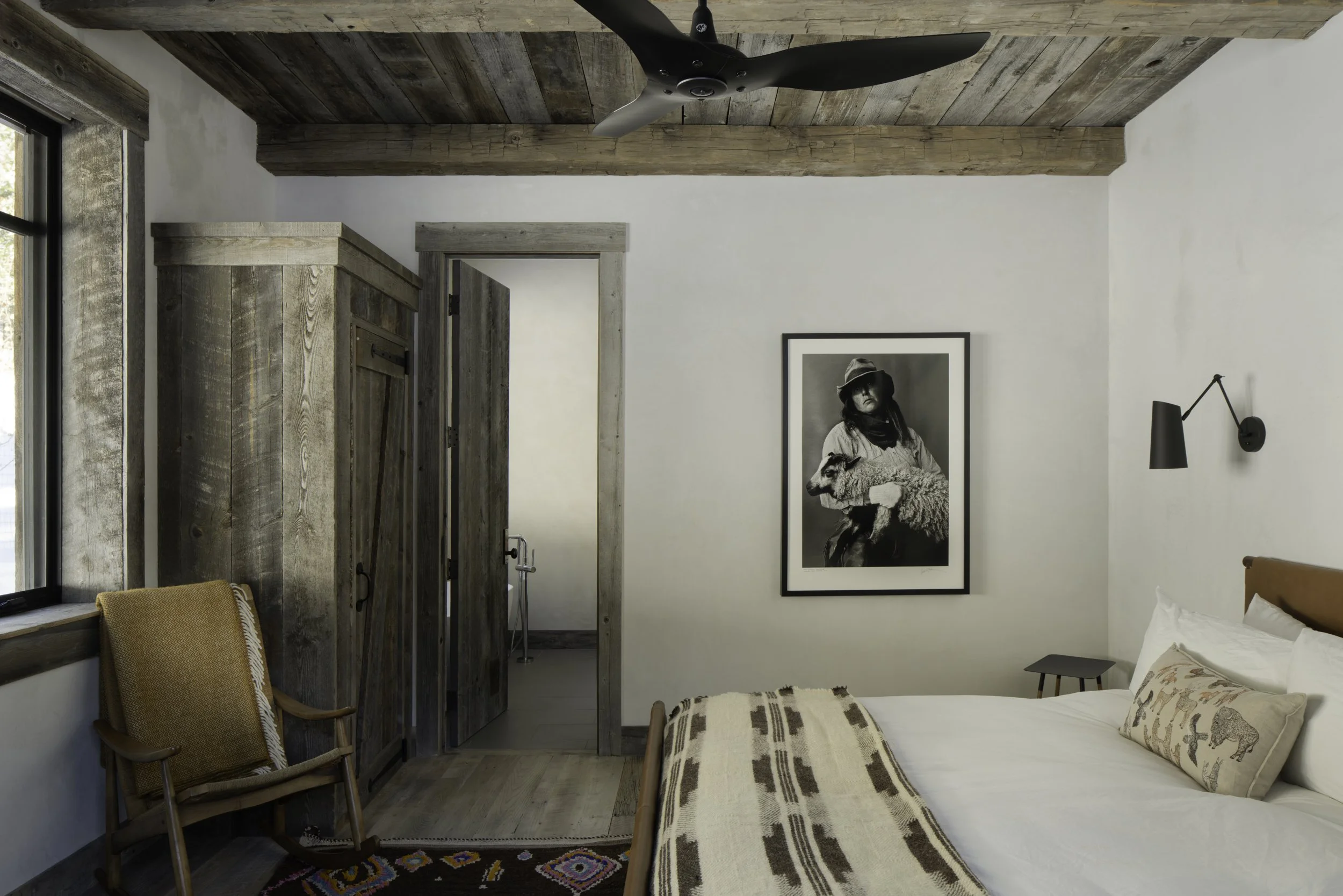 Bedroom with wood wall detail in Big Sky Montana